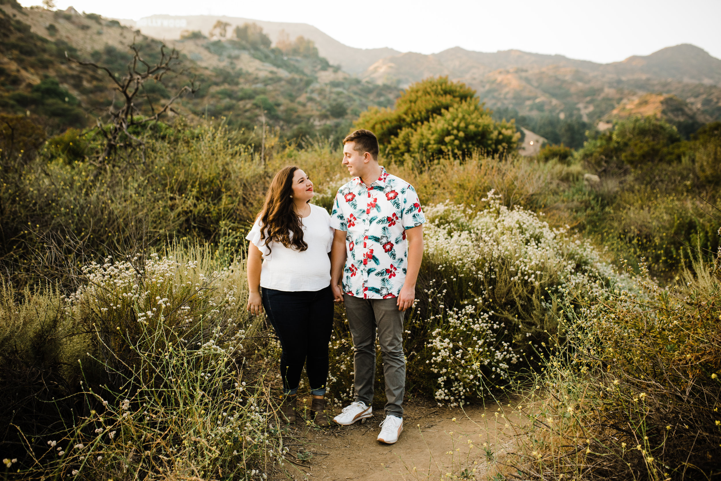 Happy couple during an adventurous Los Angeles engagement session at Bronson Canyon.