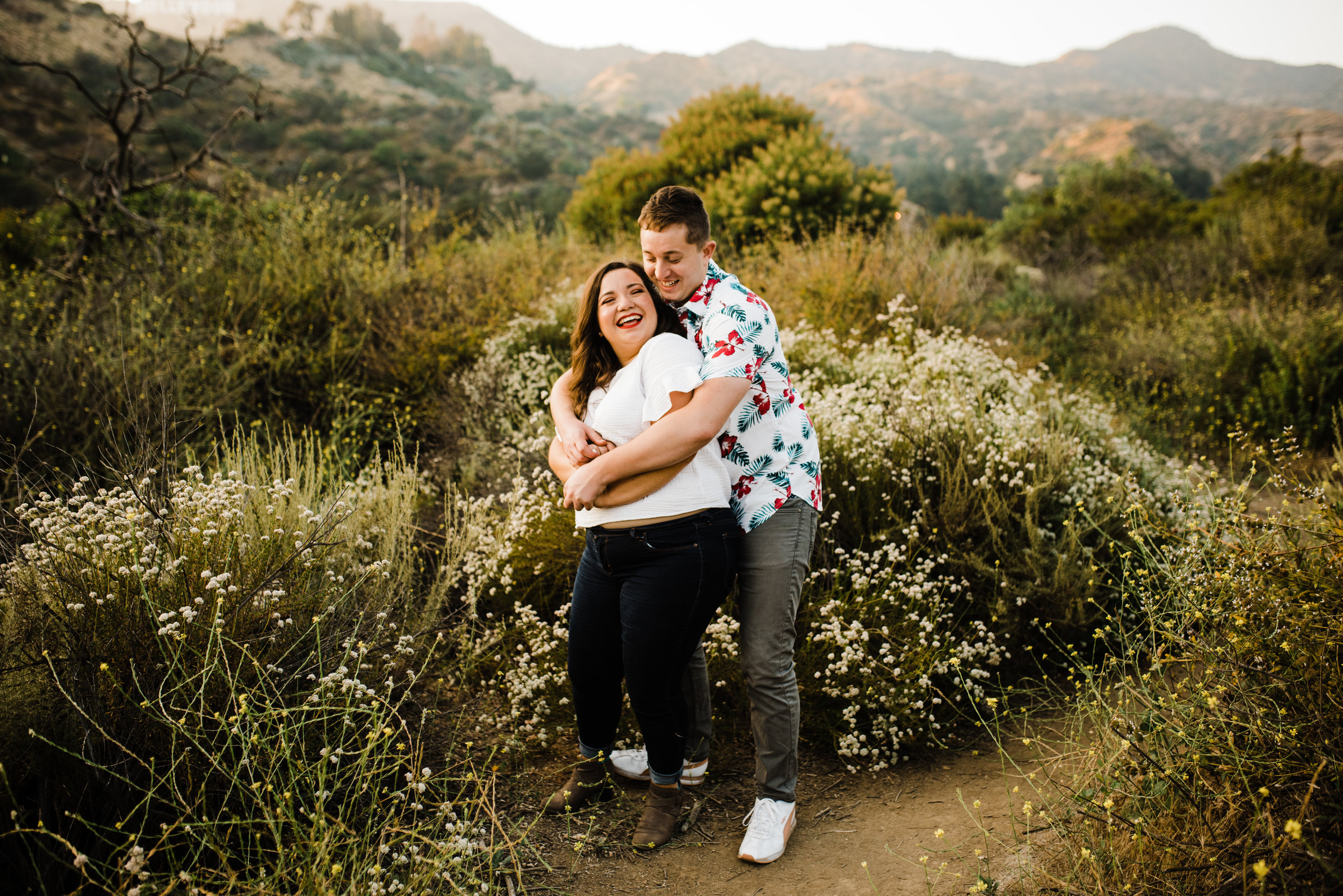 Couple dancing on the trails at Bronson Canyon for their adventurous Los Angeles engagement session