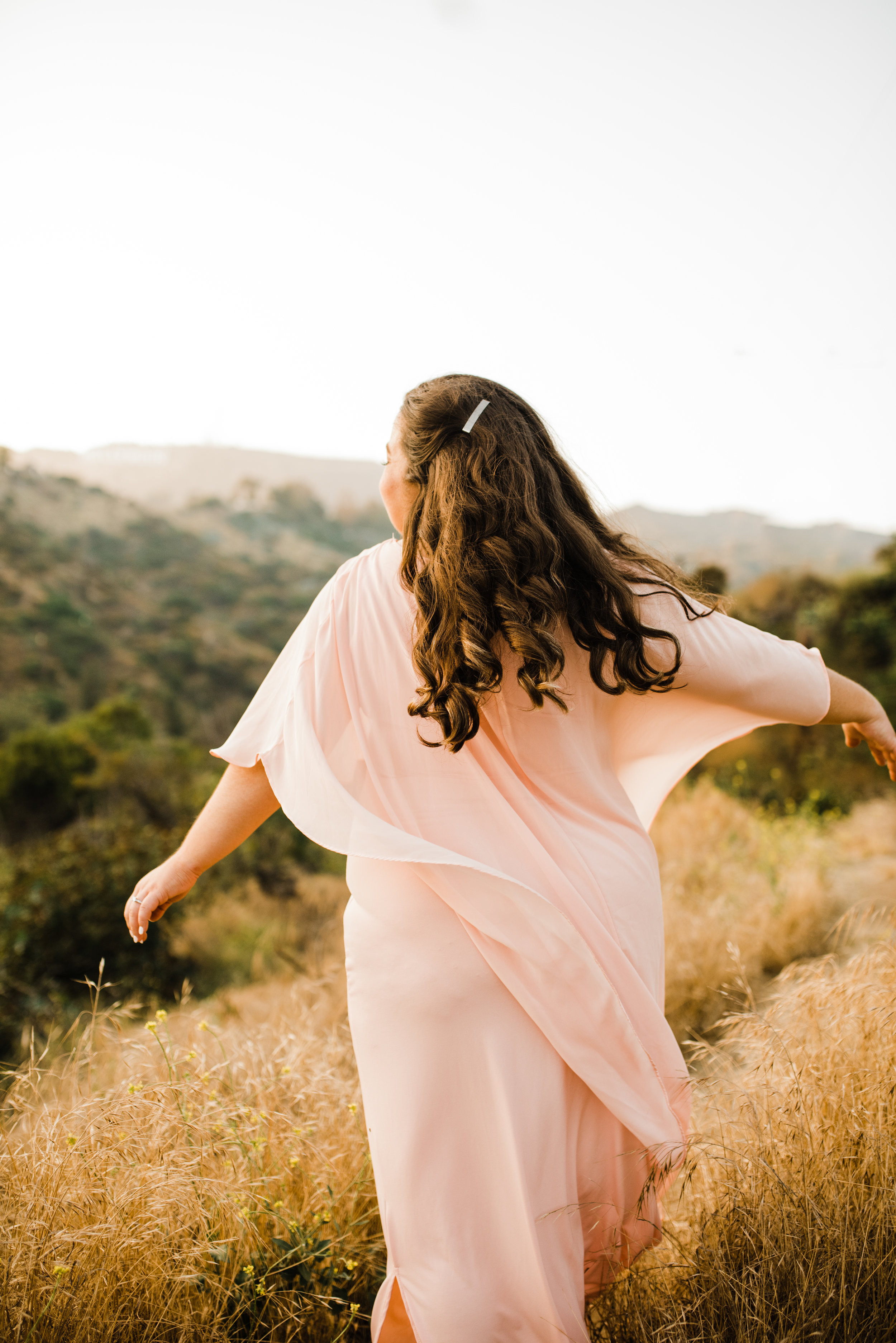 Michelle wore a beautiful pink sheer cape dress for her adventurous engagement session in Los Angeles, California