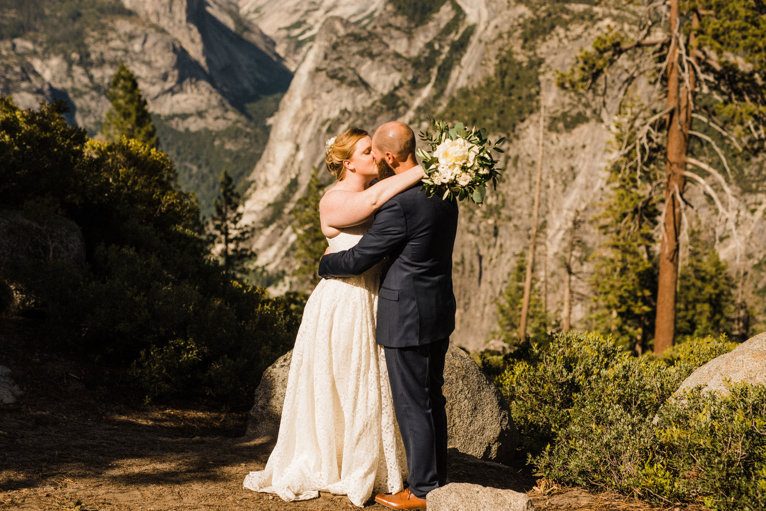 Bride and Groom on the cliff at Glacier Point in Yosemite