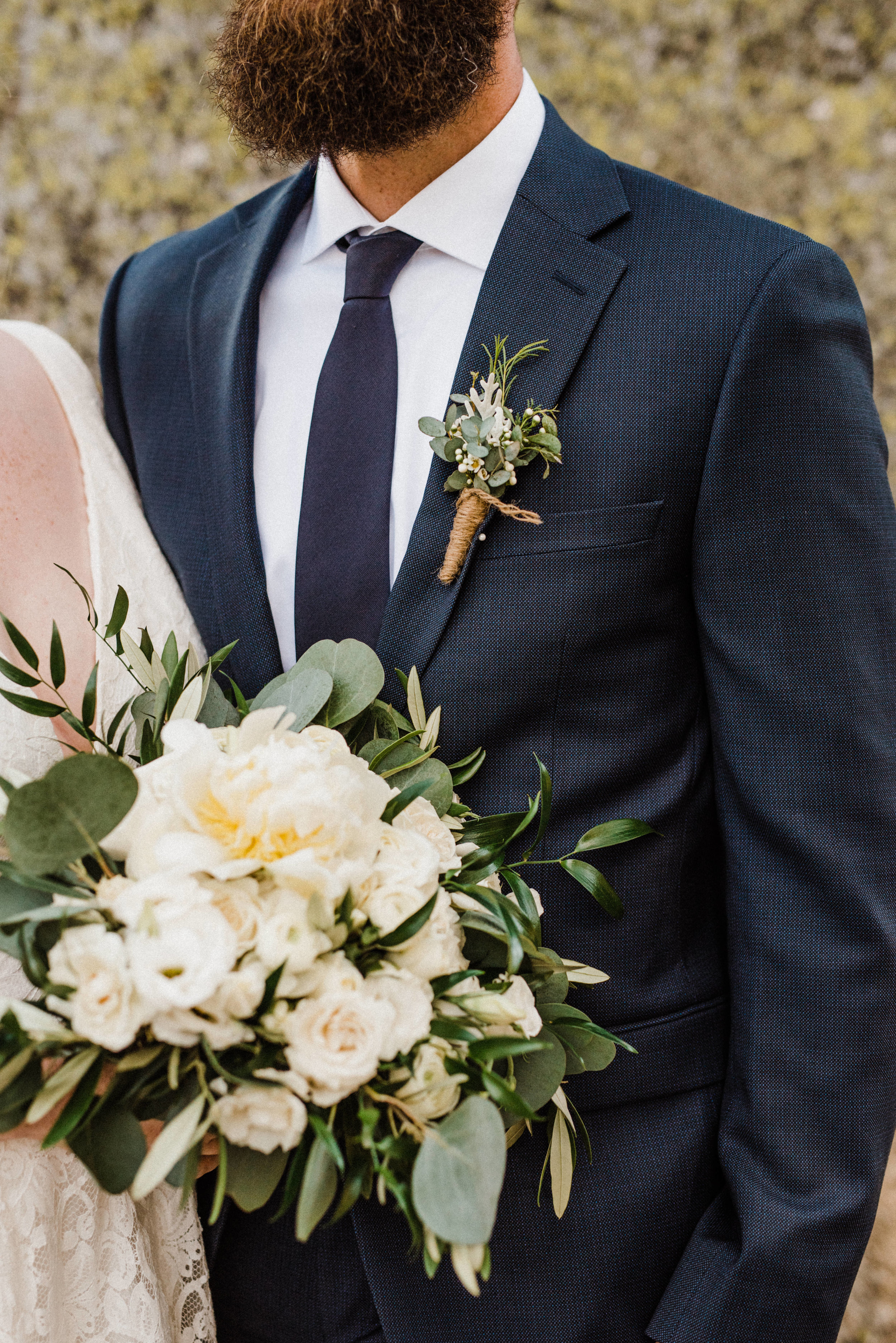 Romantic and classic eucalyptus and white rose floral bouquet and boutonniere at Glacier Point elopement