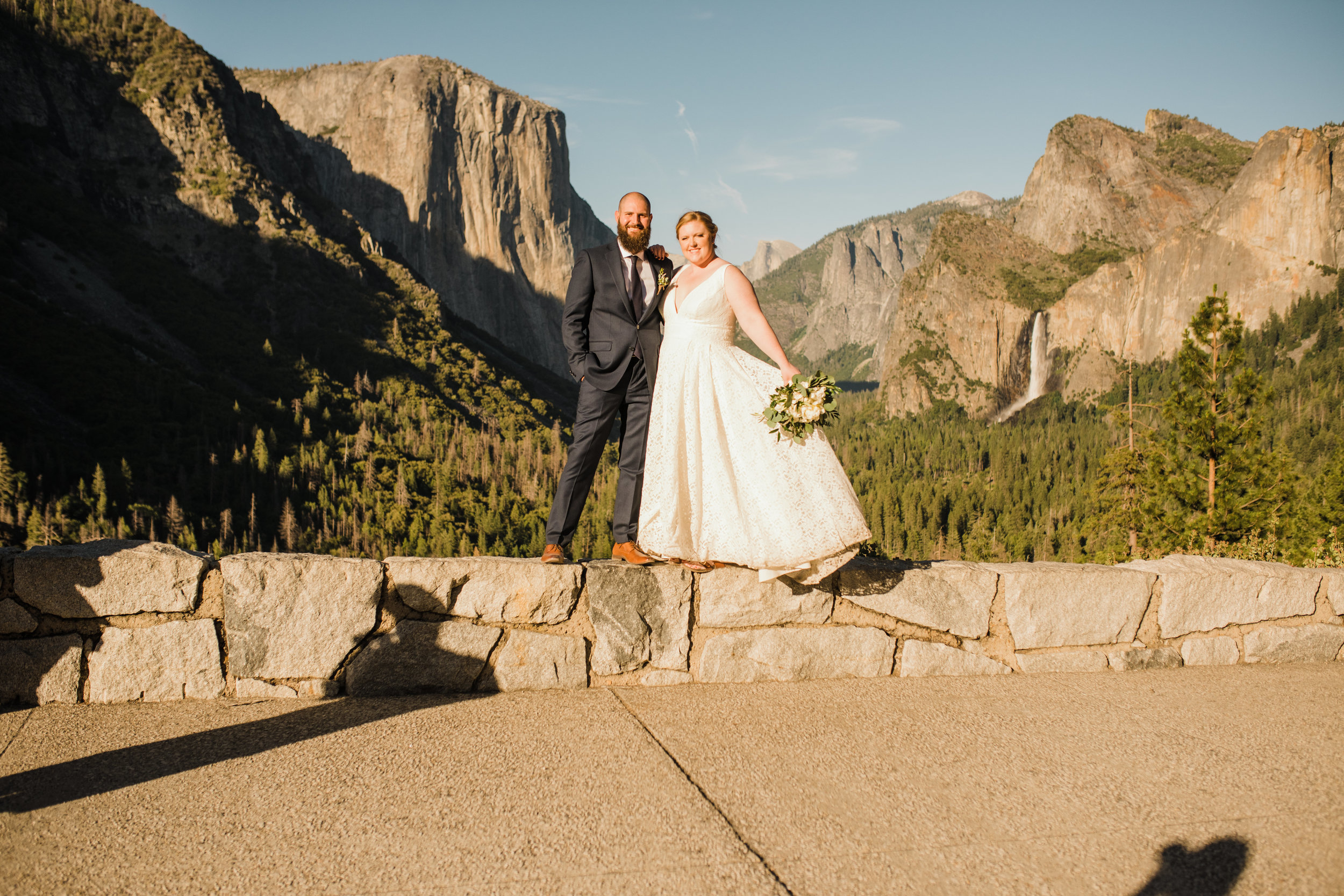 Married couple after Glacier Point Ceremony Standing in front of Half Dome and El Capitan at Yosemite's Tunnel View