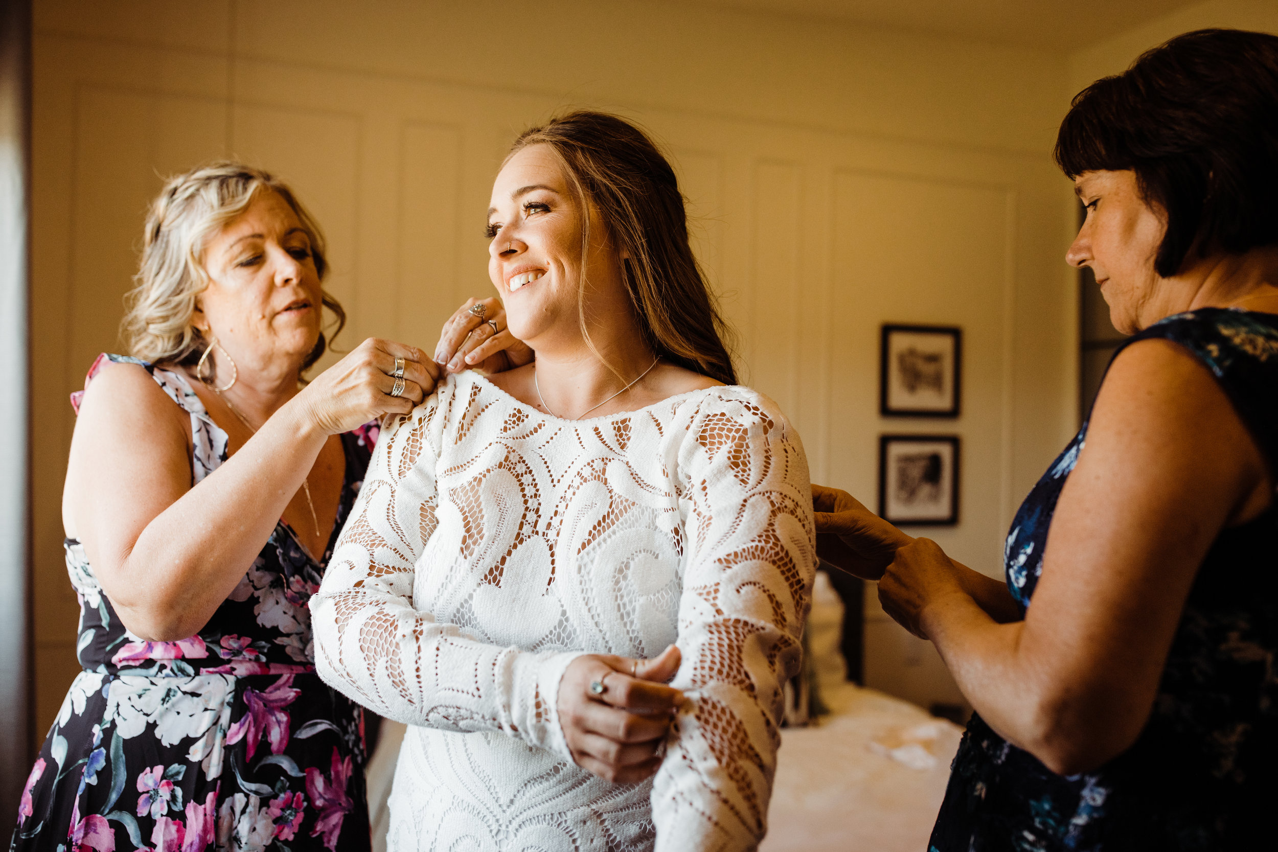Bride in Lovers Society Boho Crochet dress getting ready with mother of the bride and mother of the groom at Serenity Escape JT