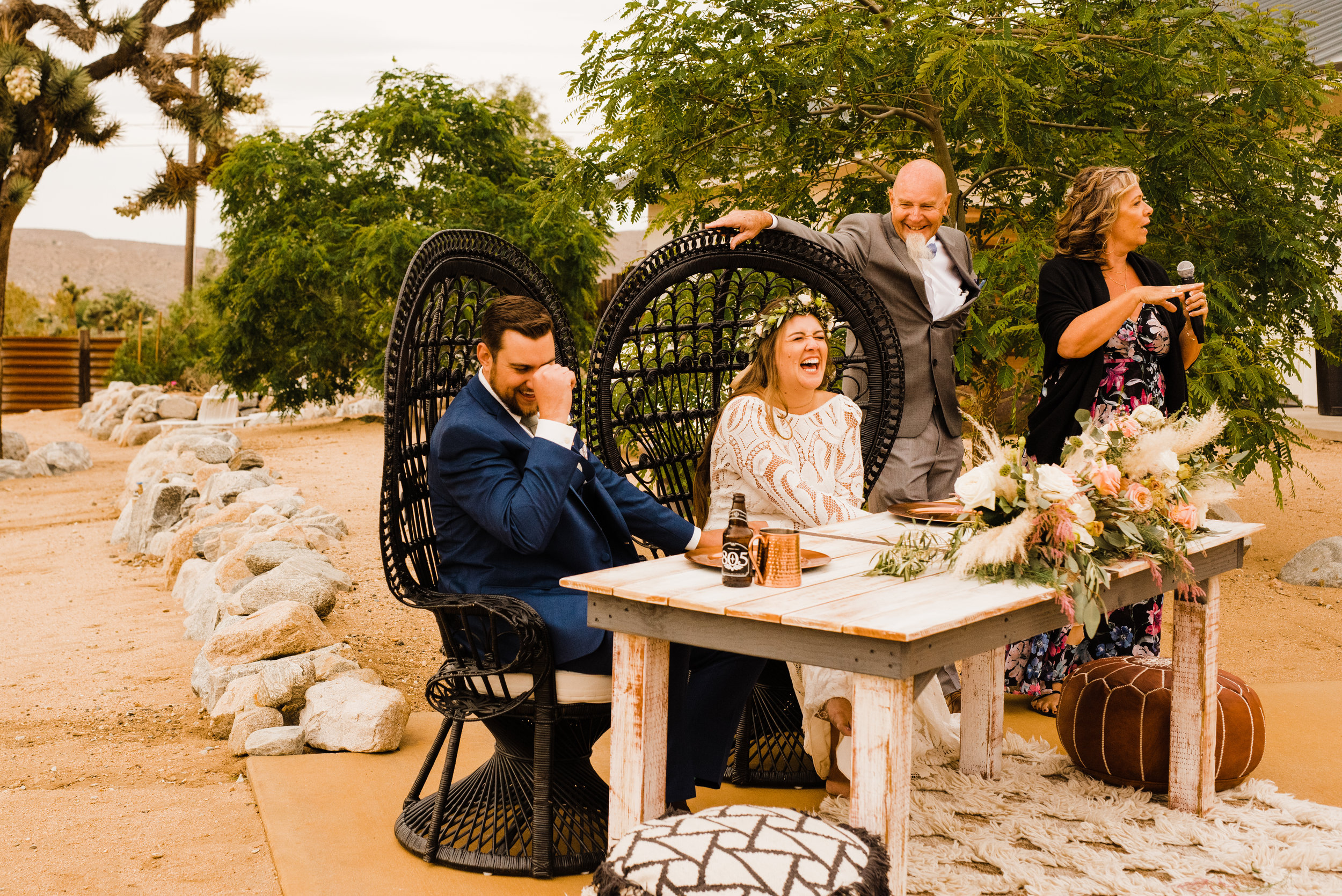 Bride and Groom laughing during toasts at Tumbleweed Sanctuary Reception