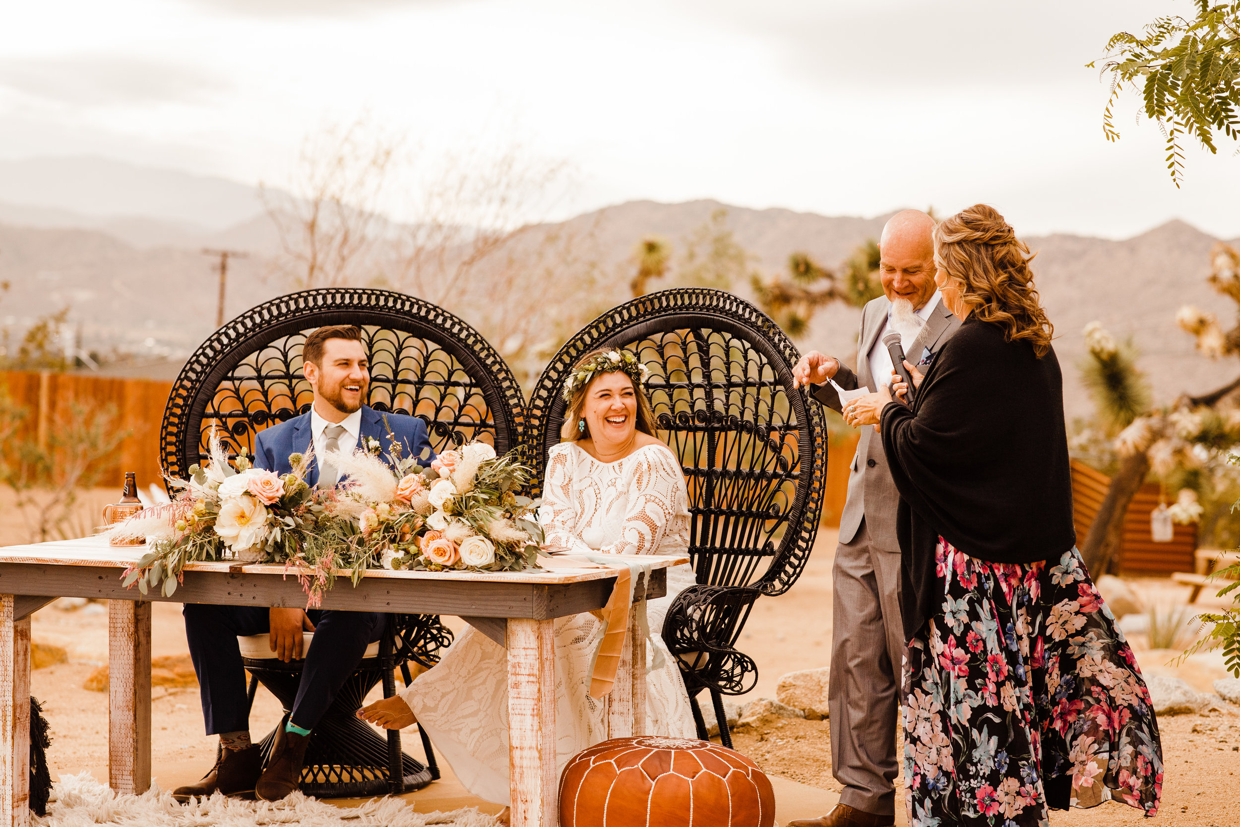 Bride and Groom laughing during toasts by mother of the bride at tumbleweed sanctuary wedding reception