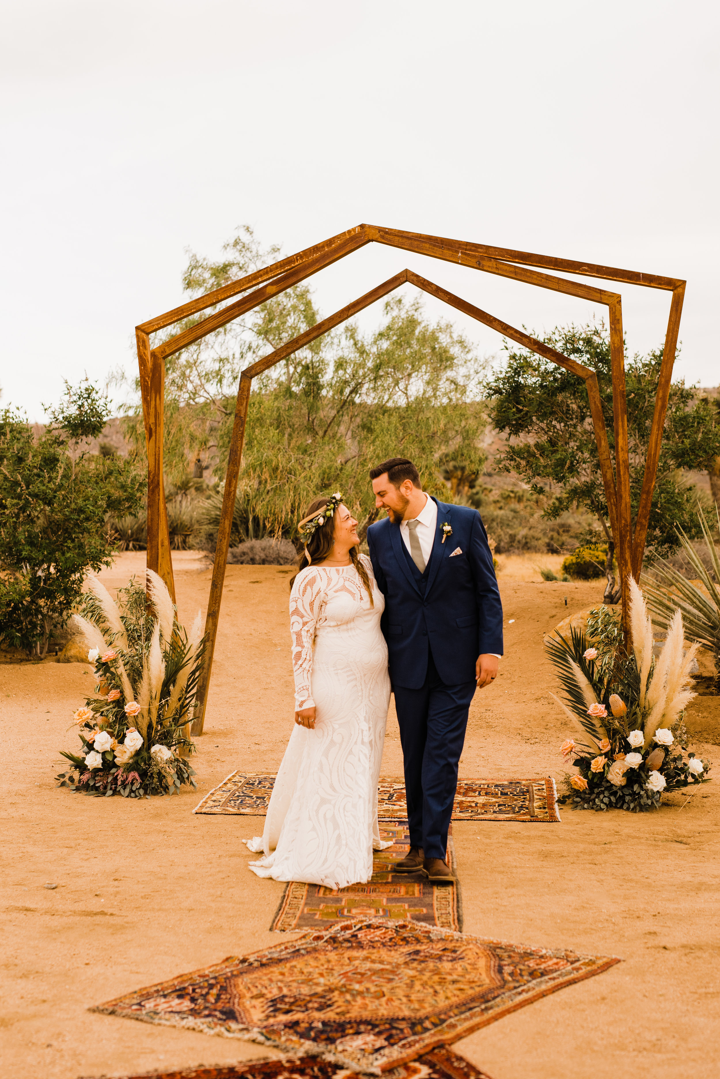Tumbleweed Sanctuary Wedding couples portraits under metal geometric arch