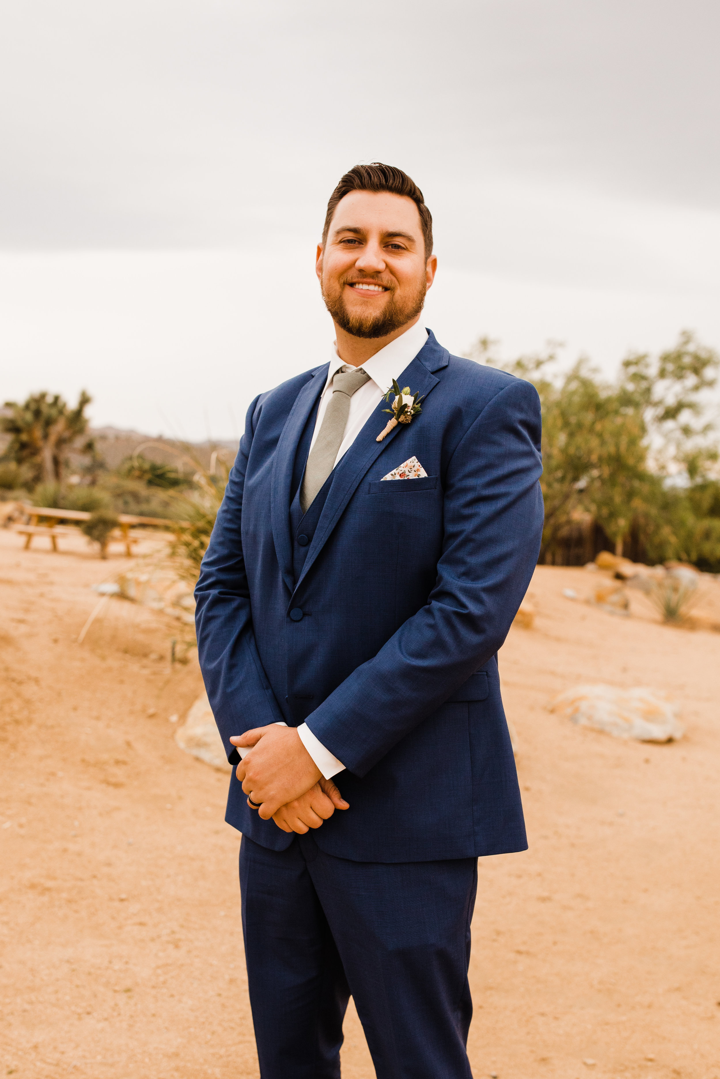 Groom in Blue Suit by Friar Tux at Tumbleweed Sanctuary Garden