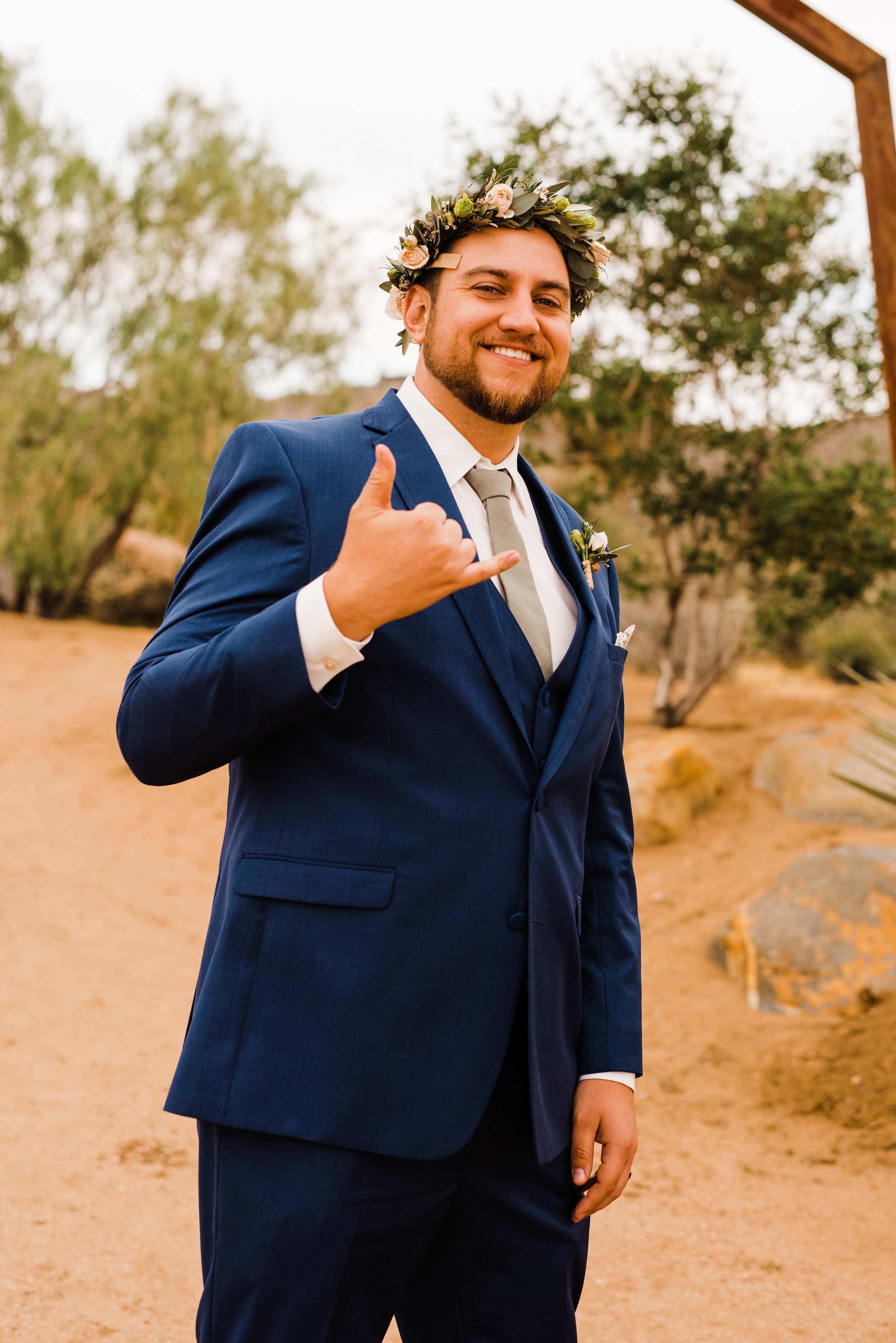 Groom with hawaiian lei flower crown at tumbleweed sanctuary 