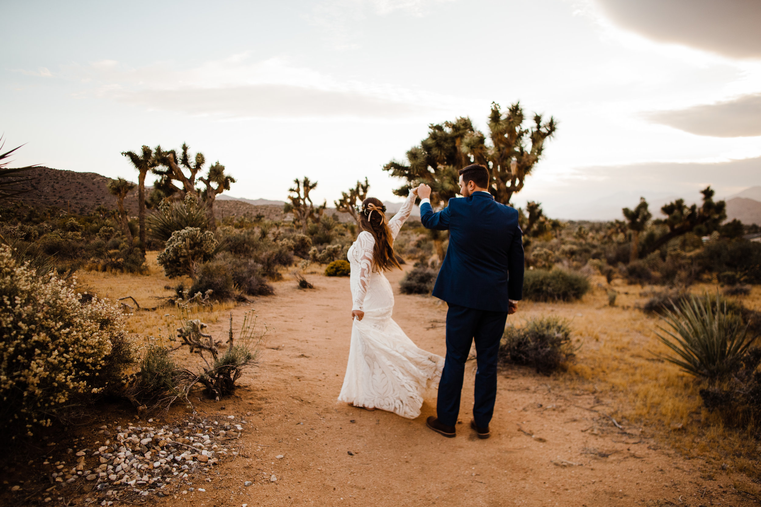 bride and groom dancing in the desert of joshua tree being tumbleweed wedding venue 