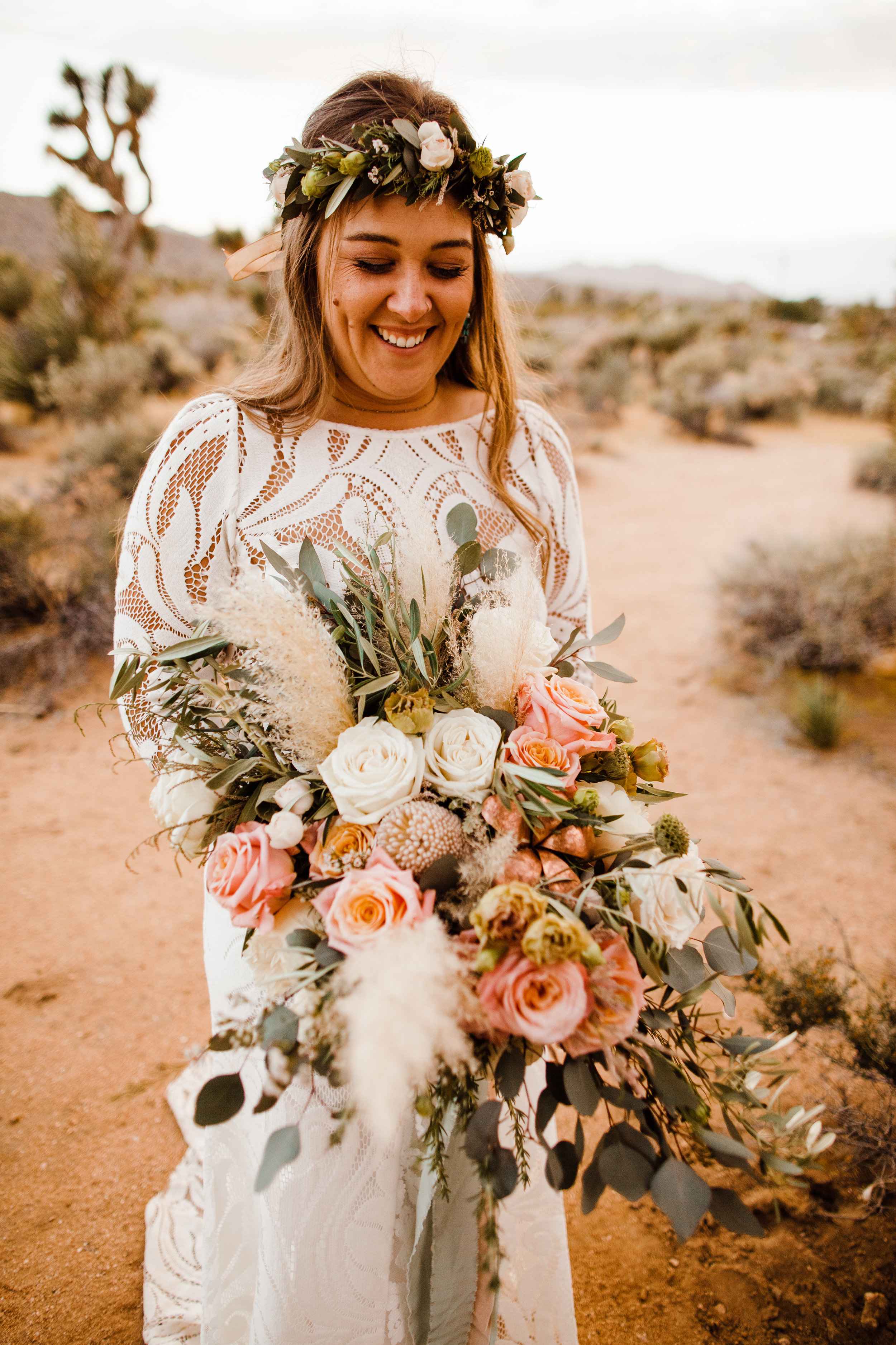 bride holding bouquet by Pinyon Pine floral design after tumbleweed sanctuary wedding