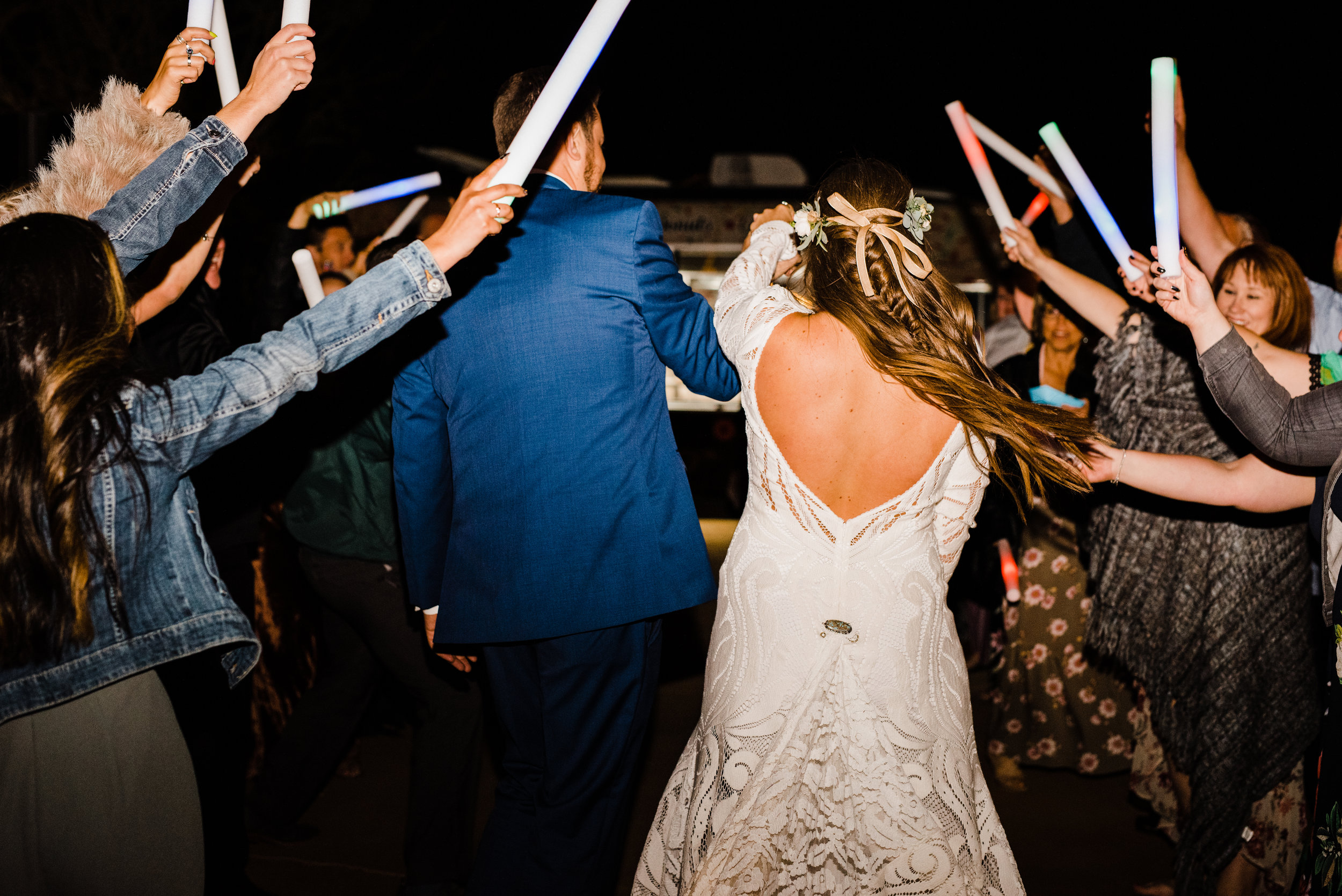 grand finale wedding exit with glow sticks at tumbleweed sanctuary