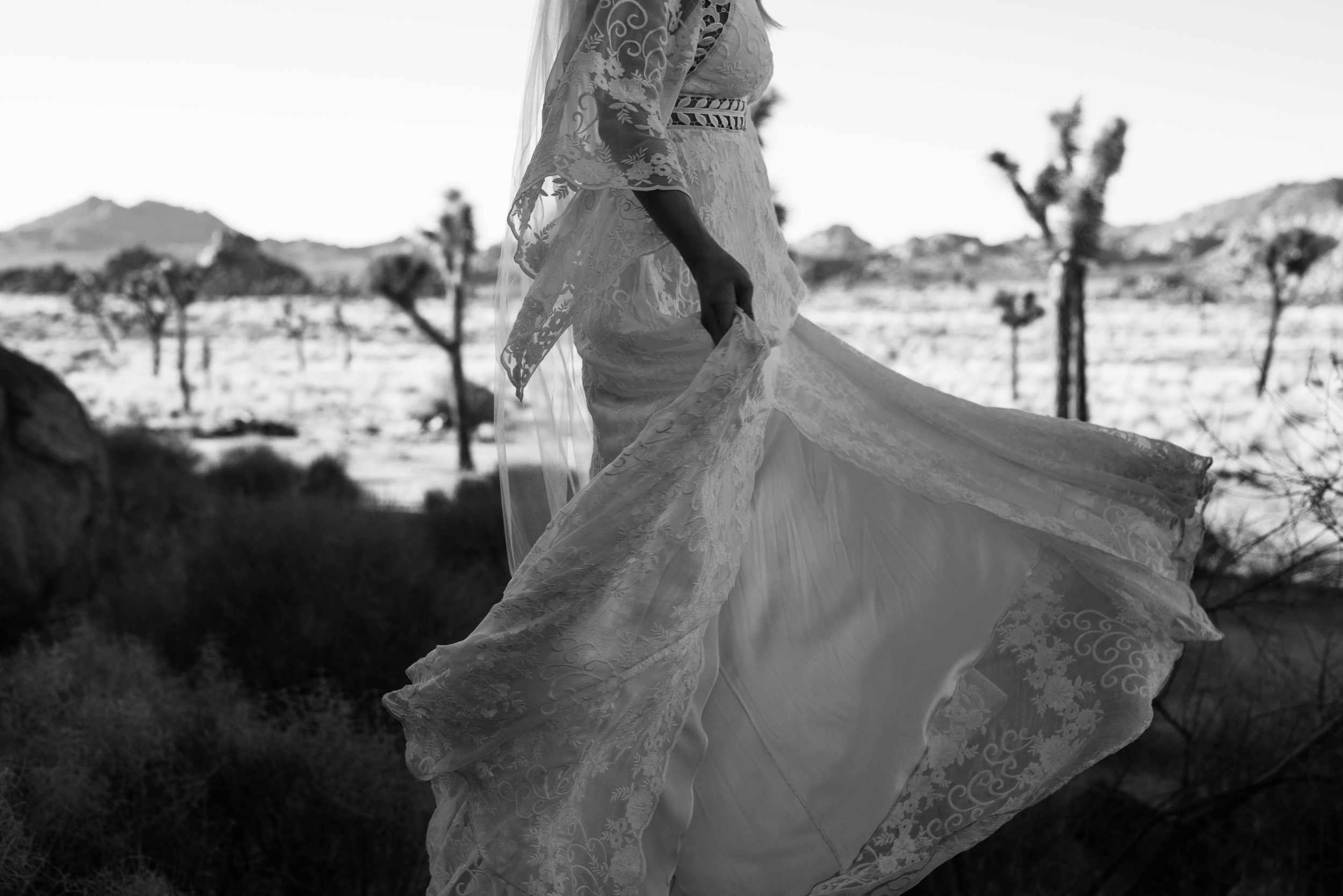 Bride in lacey boho rue de seine dress at Joshua Tree National Park