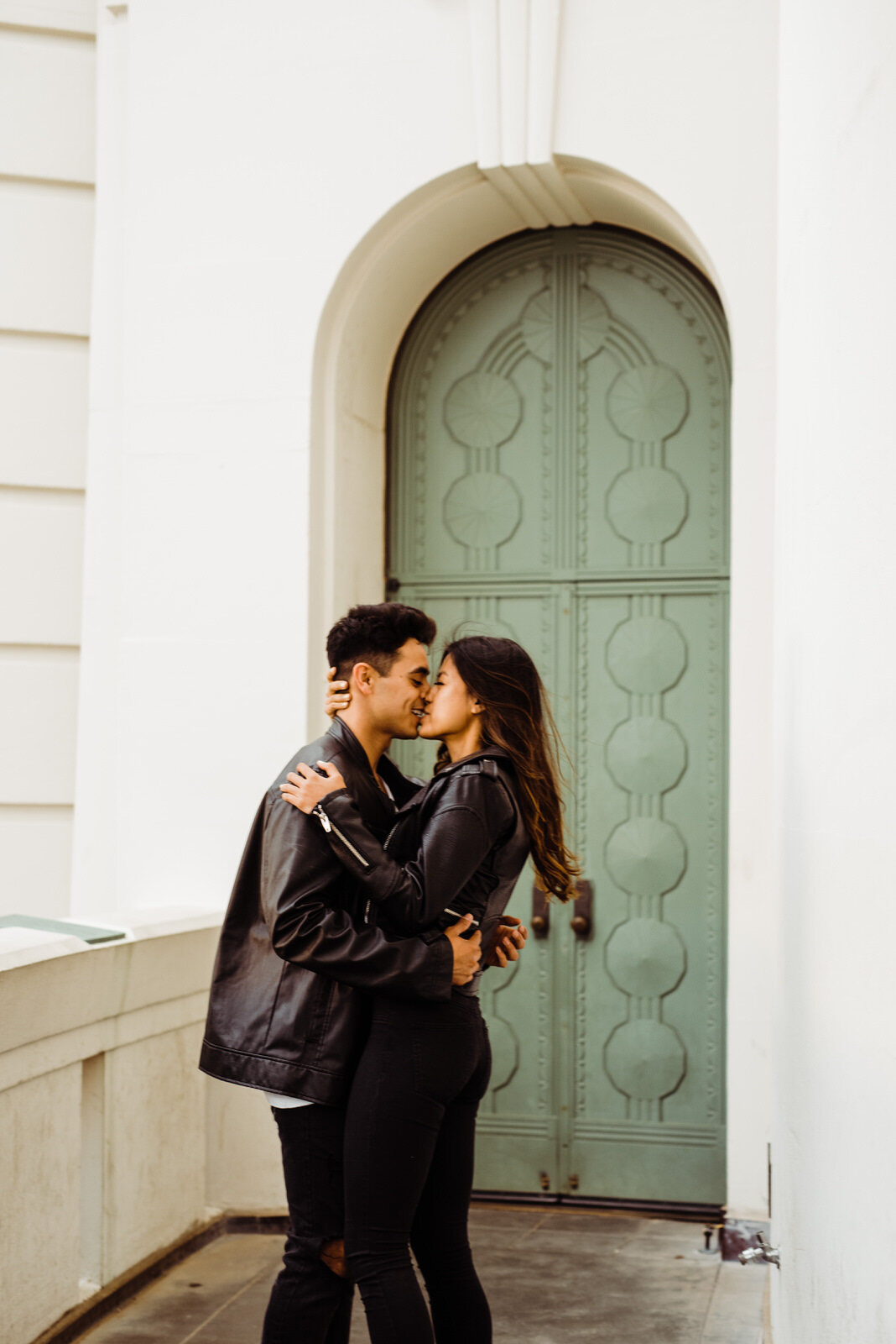 Engaged Couple Kissing At Griffith Observatory