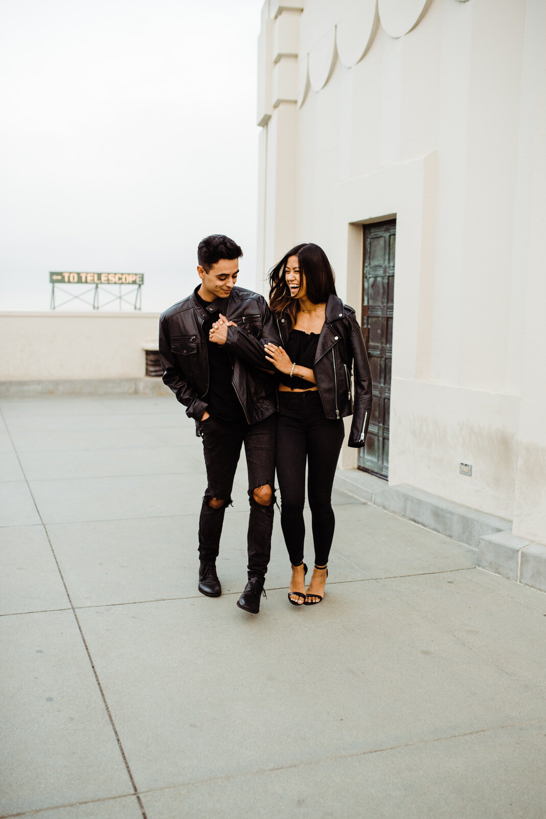 Couple walking near Griffith Observatory Telescope in Griffith Park