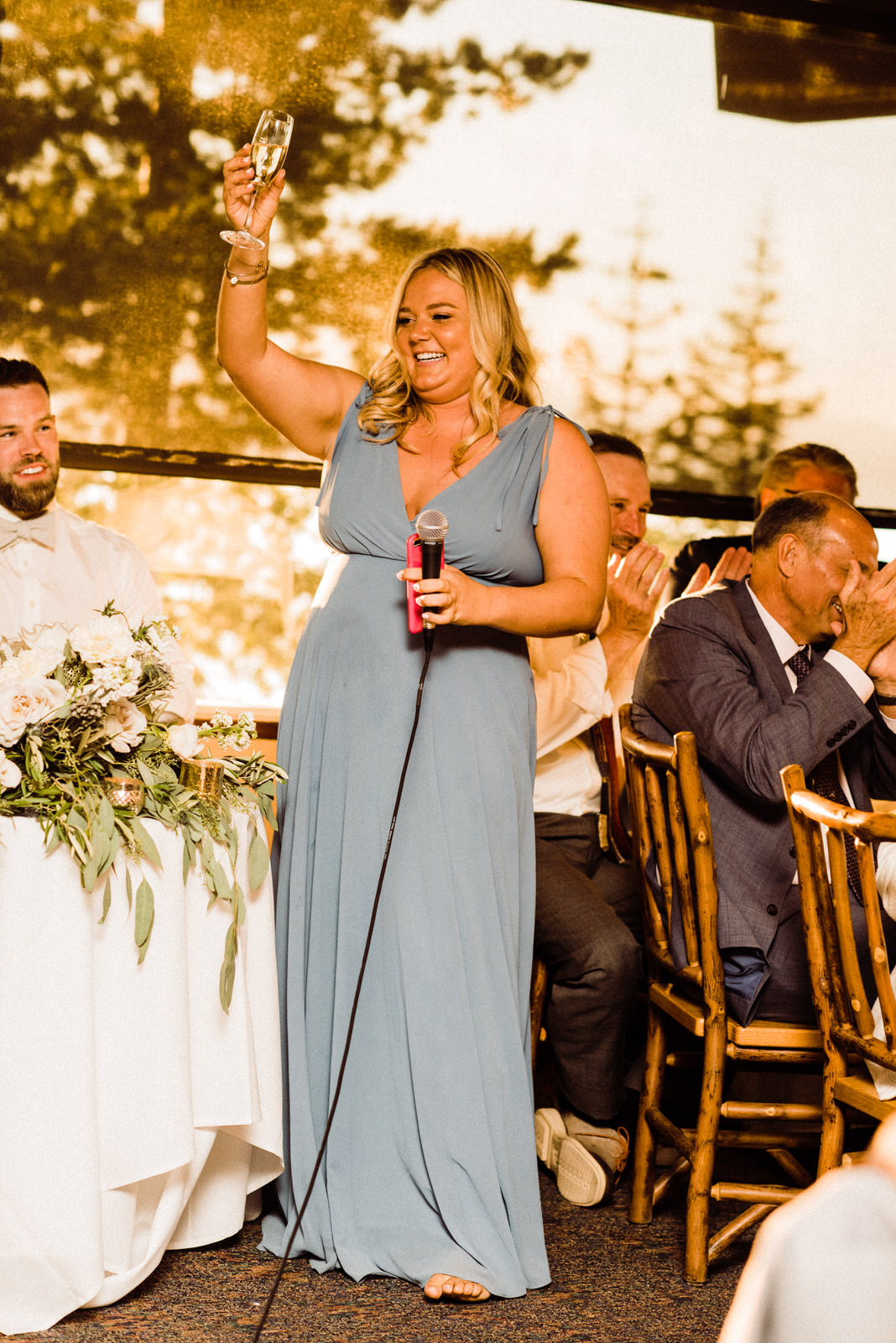 Maid of Honor champagne toasts the couple at Summer Heavenly Lakeview Lodge Wedding