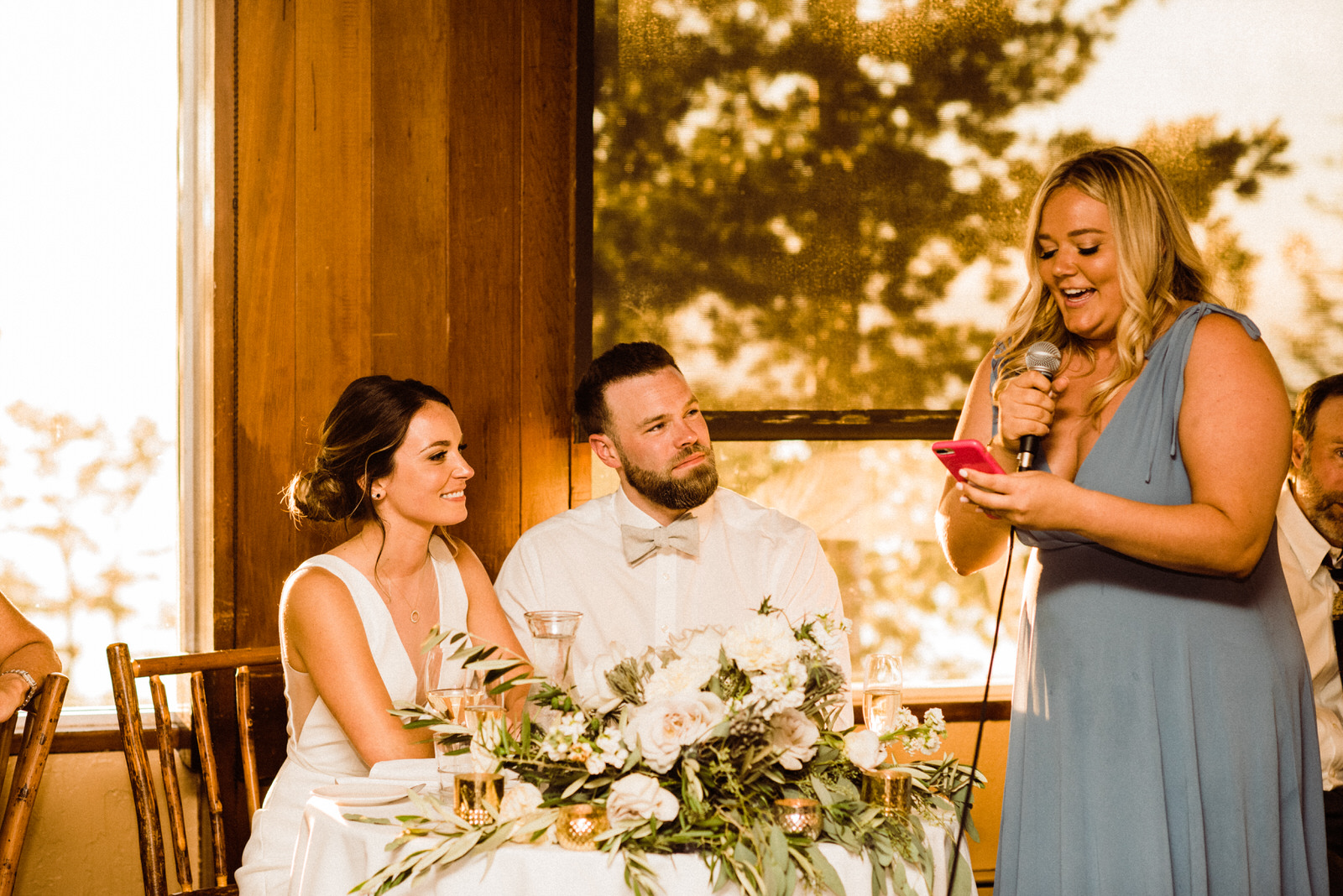 Bridesmaid in Light Blue dress giving speech at Heavenly Lakeview Lodge Wedding