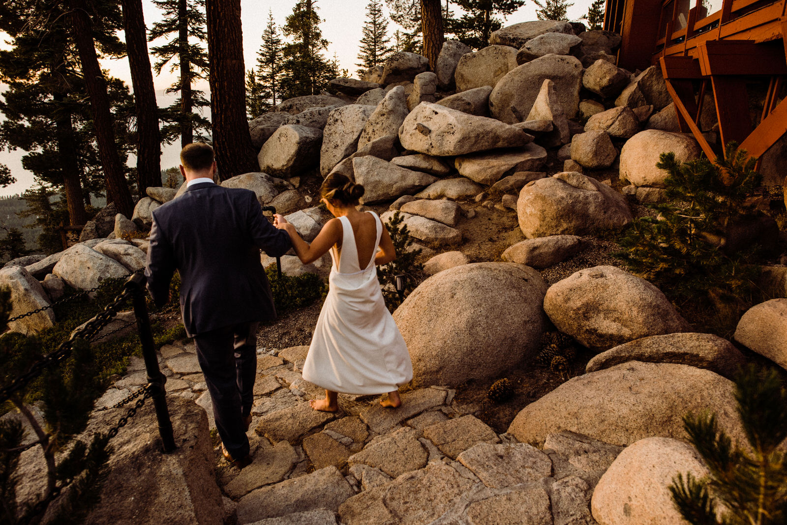 Couple walks to Lake View during golden hour in South Lake Tahoe California