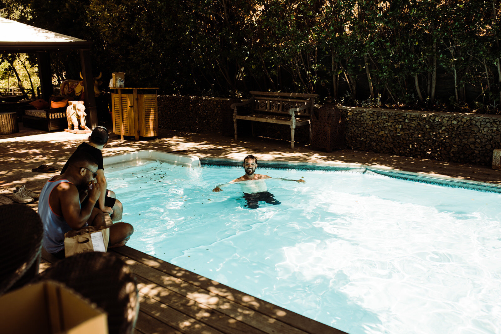 Groom Swimming in Harry Houdini Pool at Houdini Estate Wedding - candid wedding photo by Kept Record - www.keptrecord.com