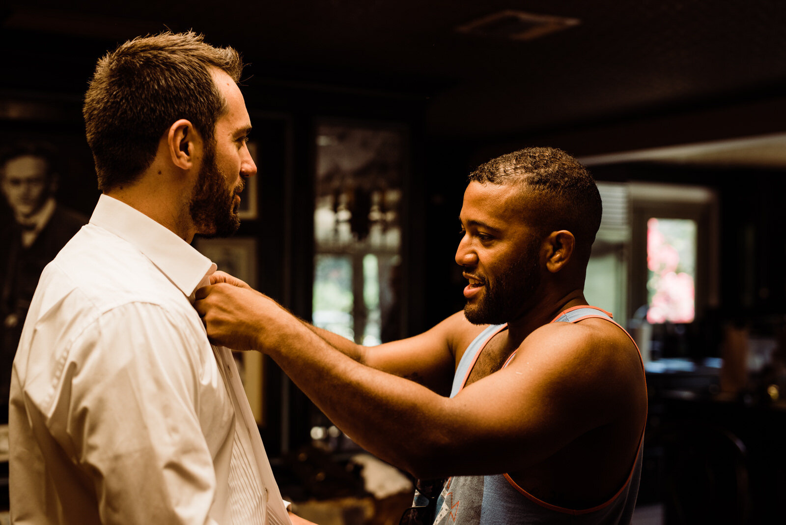 Best man helping button shirt at Houdini Estate wedding