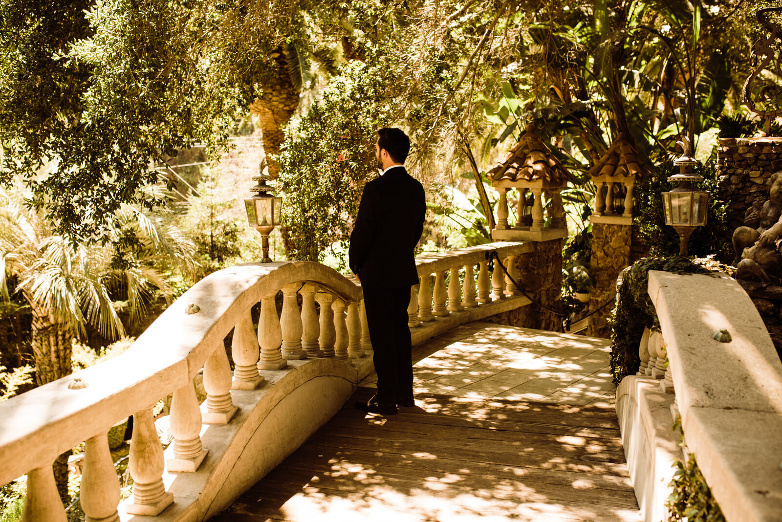 Groom in Black Tux on Garden Terrace Before Houdini Estate Wedding First Look | photo by Kept Record | www.keptrecord.com