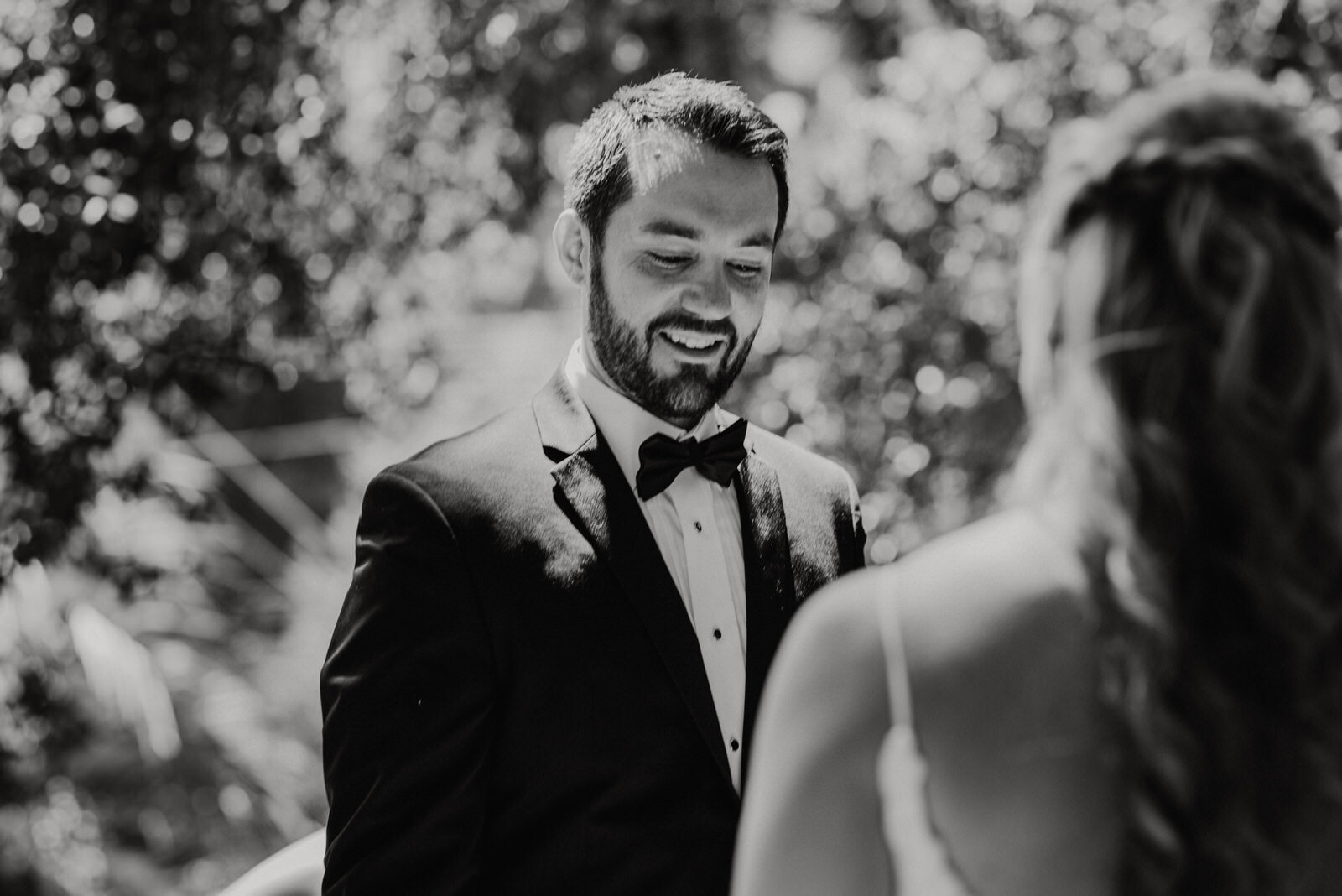 Black and white photo of Groom's Reaction to Seeing Bride at Historic Houdini Estate Wedding | Wedding First Look | LA Wedding Venue | photo by Kept Record | www.keptrecord.com