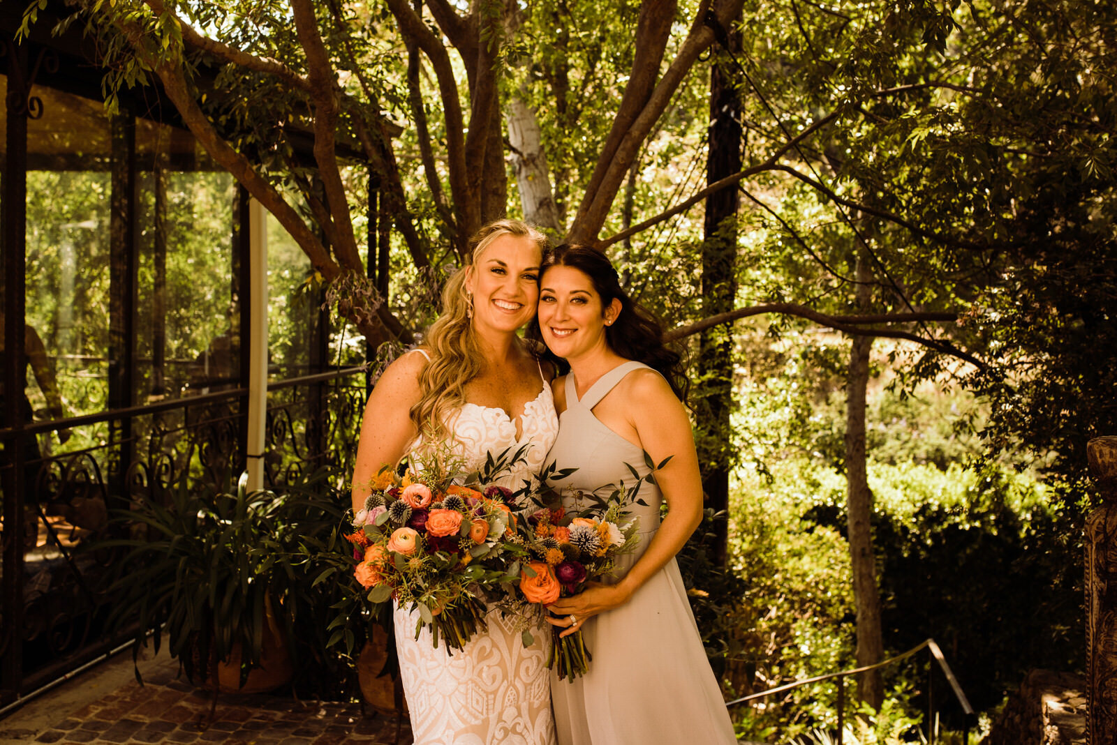 Bride and bridesmaid with Wildflora Design bouquets