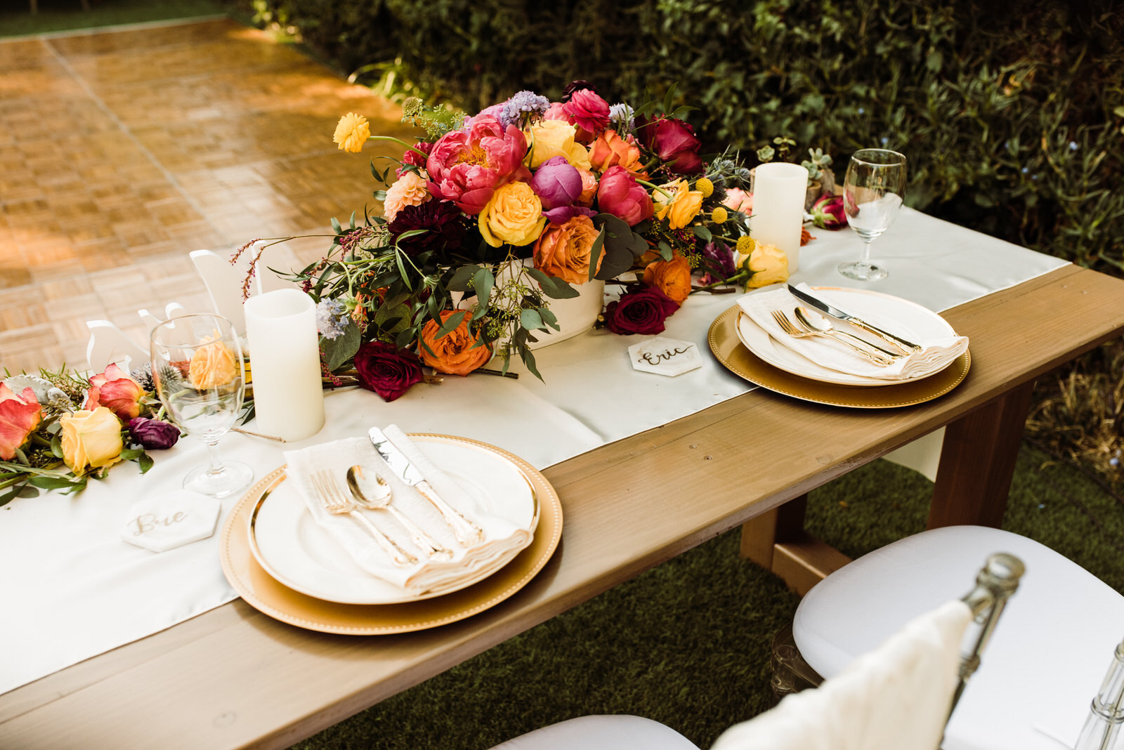 Sweetheart Table with Bright Florals and Gold Place Settings on Handmade Wooden Table | Houdini Estate Wedding | photo by Kept Record | www.keptrecord.com