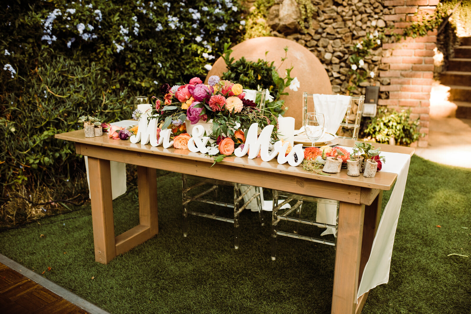 Bright, Colorful Sweetheart Table with Gold Place Settings at LA Houdini Estate Summer Wedding | photo by Kept Record | www.keptrecord.com