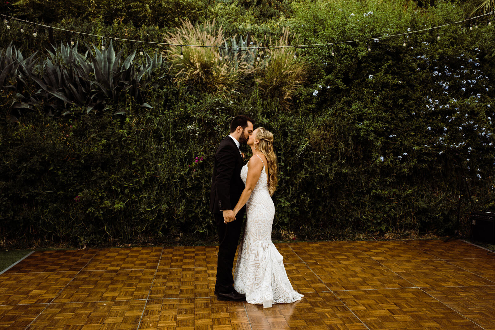 Bride in Hayley Paige Blush Wedding Dress and Groom in Black Tux Spin on Dancefloor at Houdini Estate Wedding Reception | photo by Kept Record | www.keptrecord.com