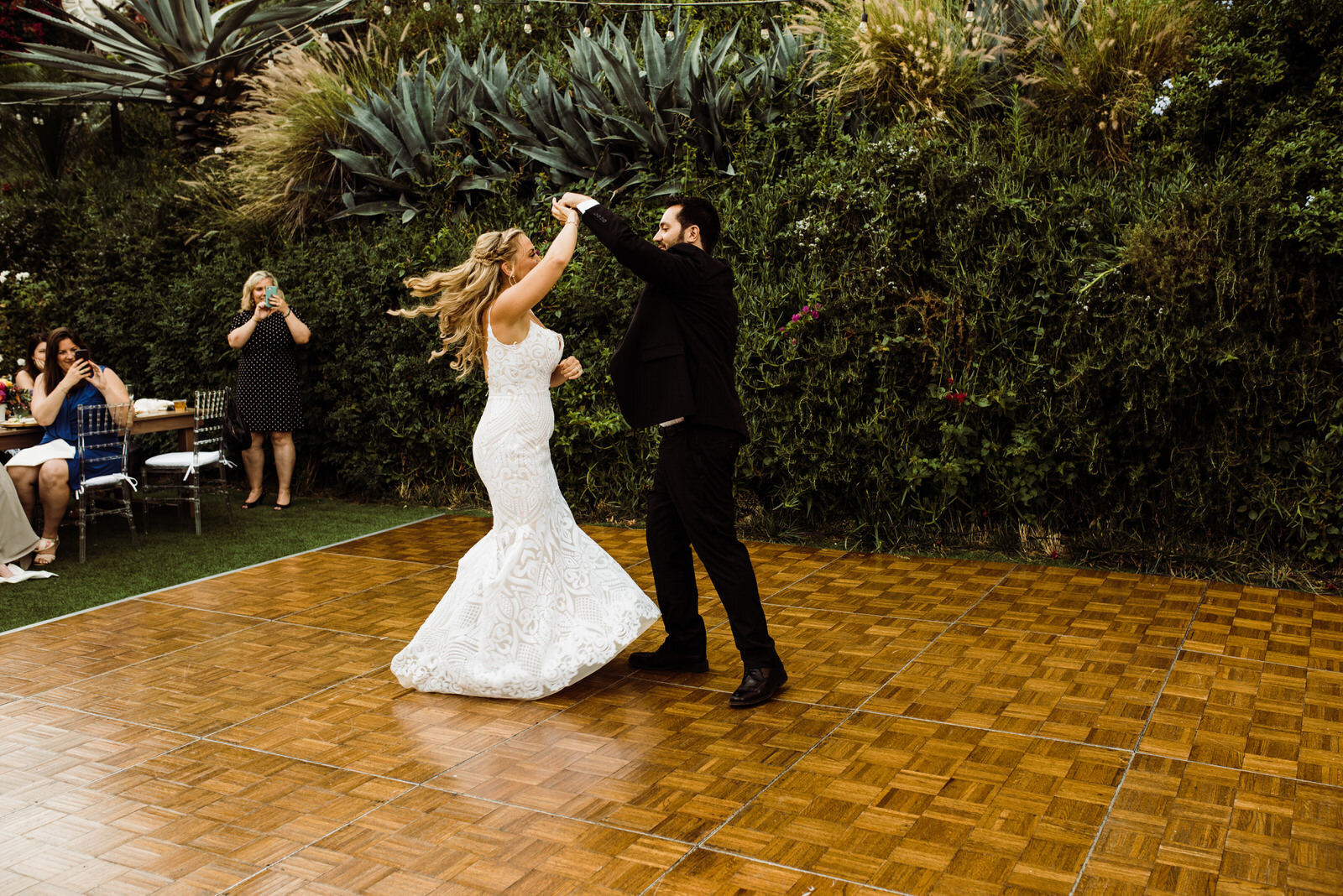 Candid Dancing Photo of Bride and Groom | Los Angeles Historic Wedding Venue Houdini Estate | First Dance | Bride in Hayley Paige dress | photo by Kept Record | www.keptrecord.com