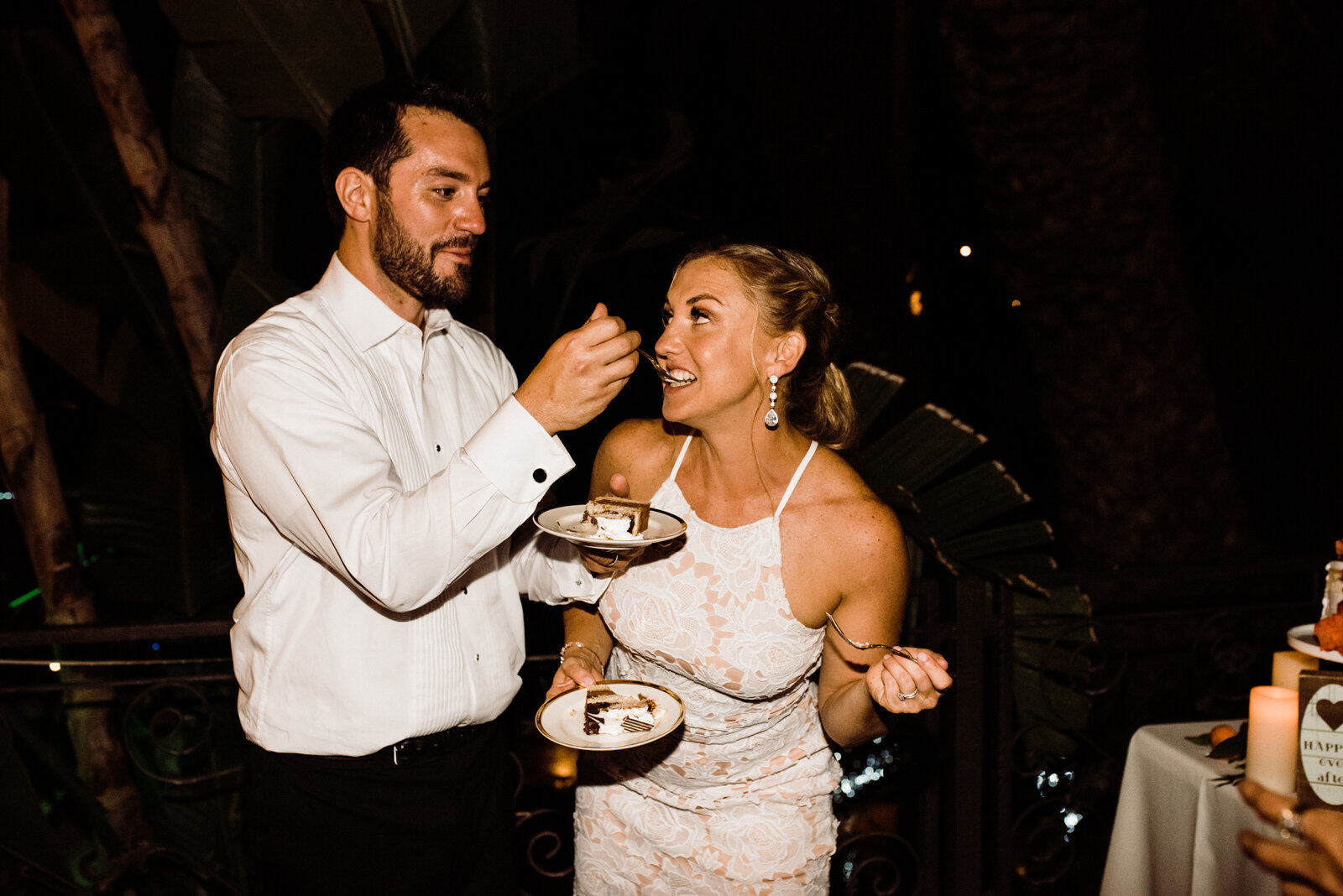 Bride and groom eating cake at Houdini Estate wedding