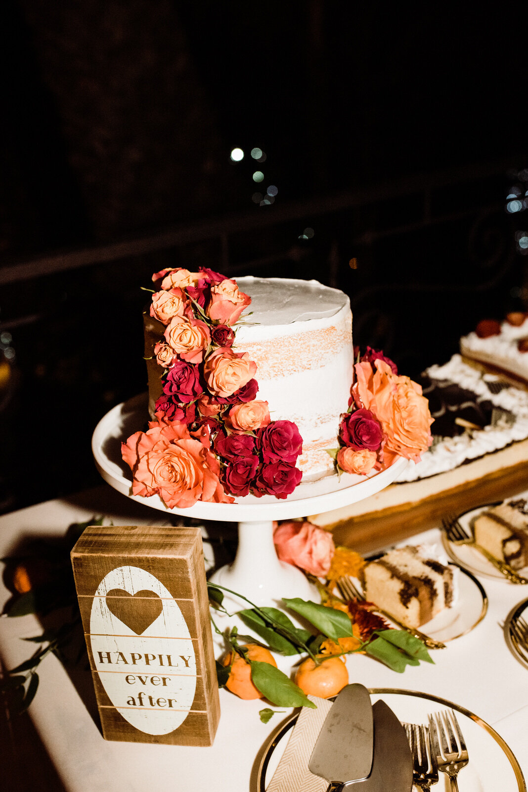 Small Wedding Cake at LA Houdini Estate Wedding | Cute and Simple Wedding Cake with Colorful Flowers | photo by Kept Record | www.keptrecord.com