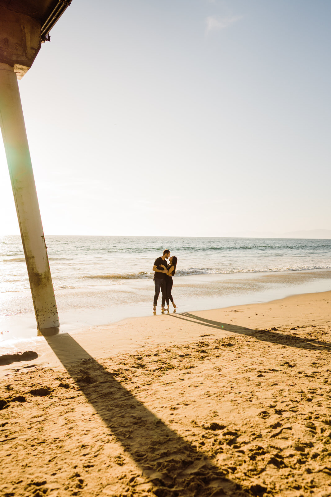 Couple at Hermosa Beach for engagement photos