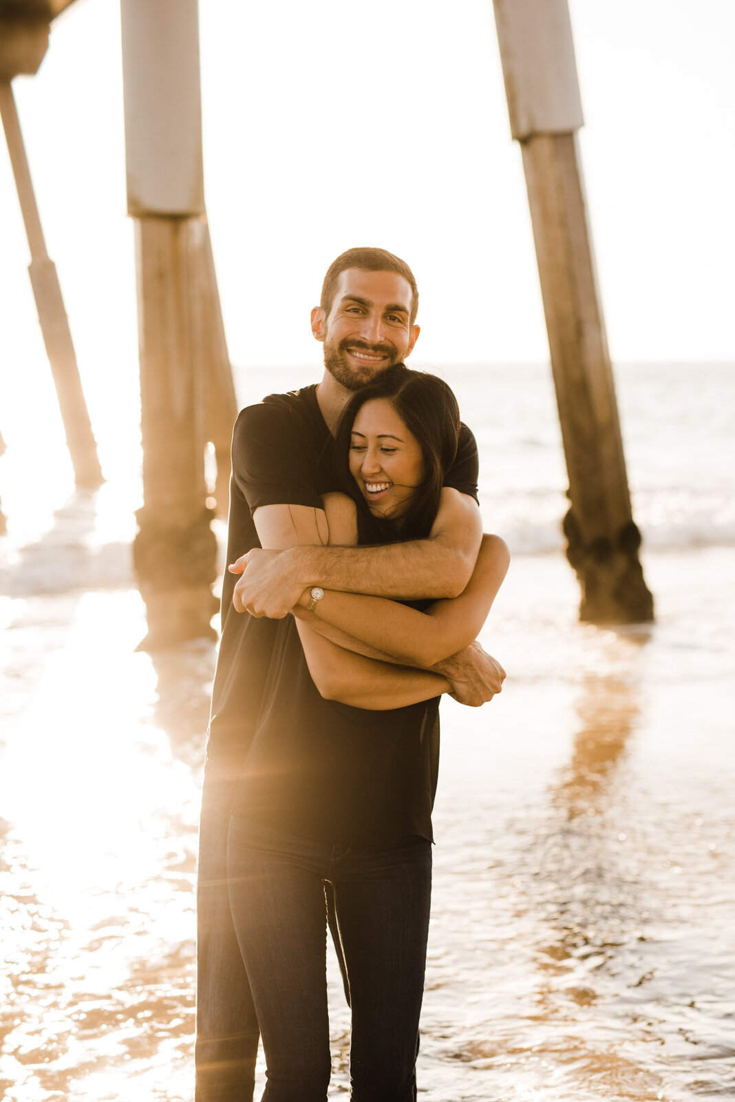 Playful, Romantic Engagement Photos beneath Hermosa Beach Pier