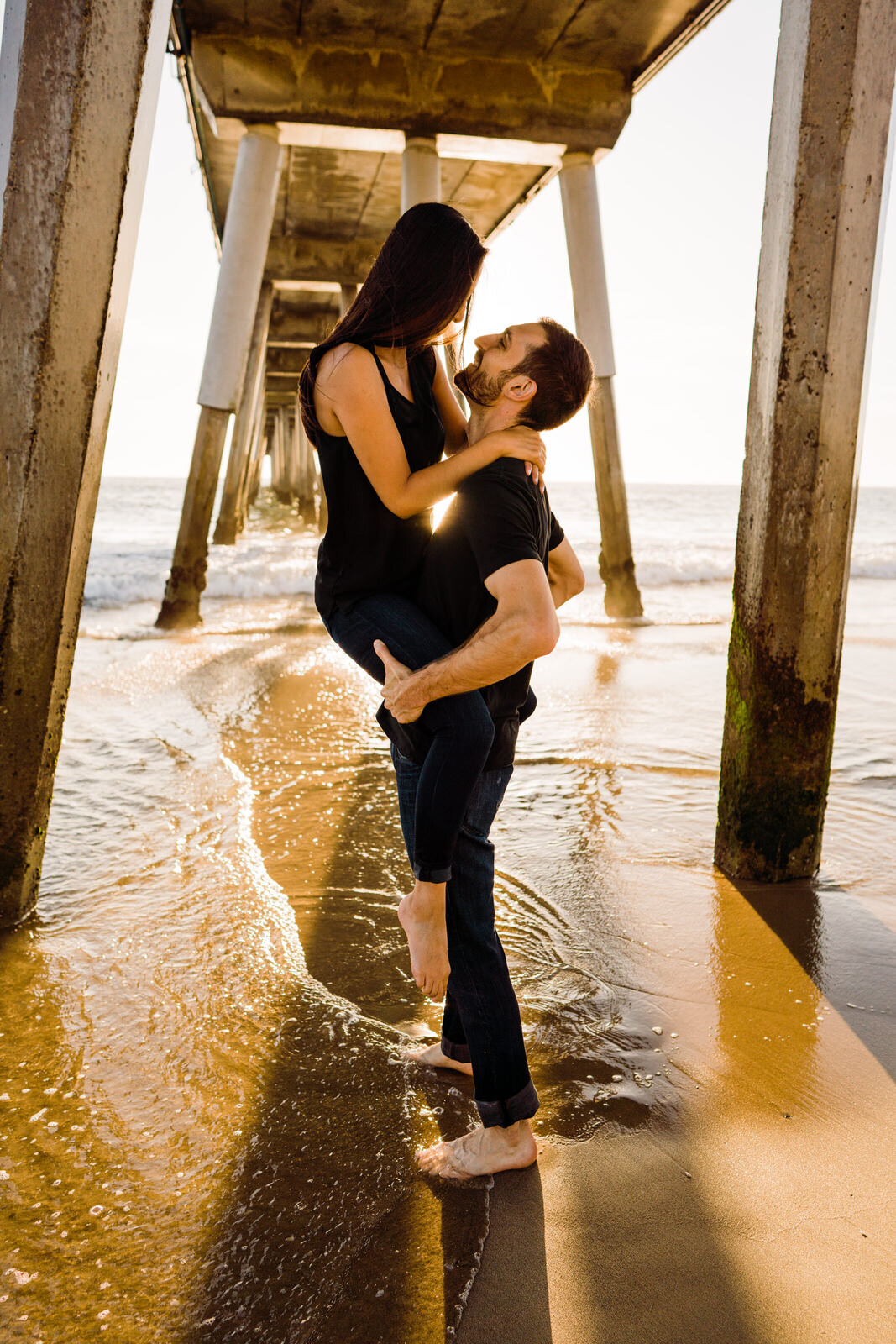 romantic and fun engagement photos of Phillipino-Mexican couple at Hermosa Beach Pier