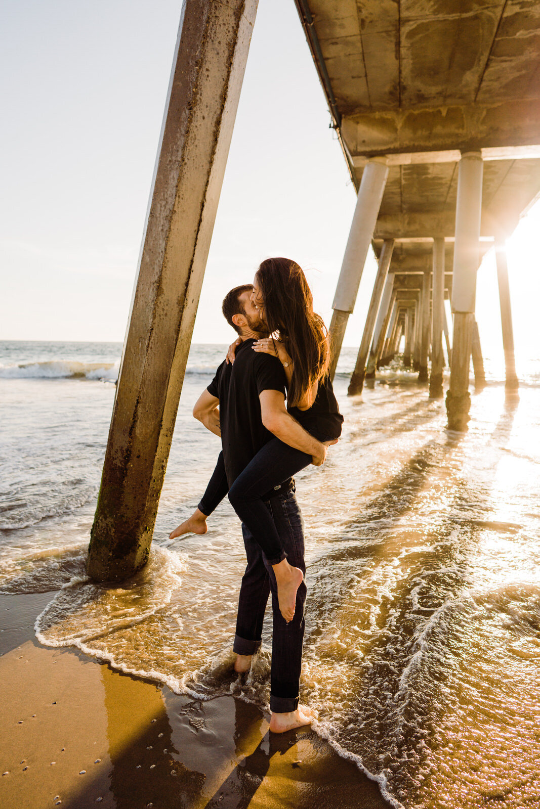 Couple plays in the water at Hermosa Beach Engagement Photos