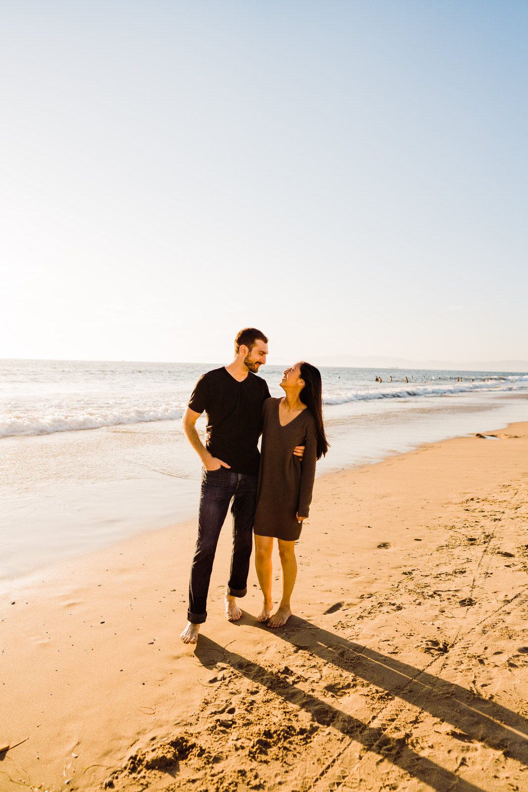 Backlit sunny engagement photos at Hermosa Beach 