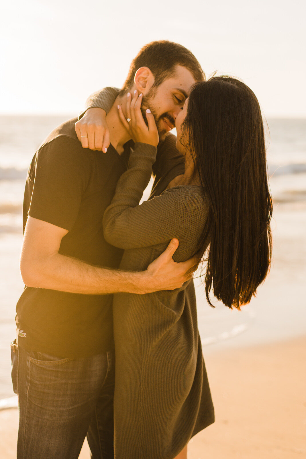Engaged couple shares romantic kiss at Hermosa Beach
