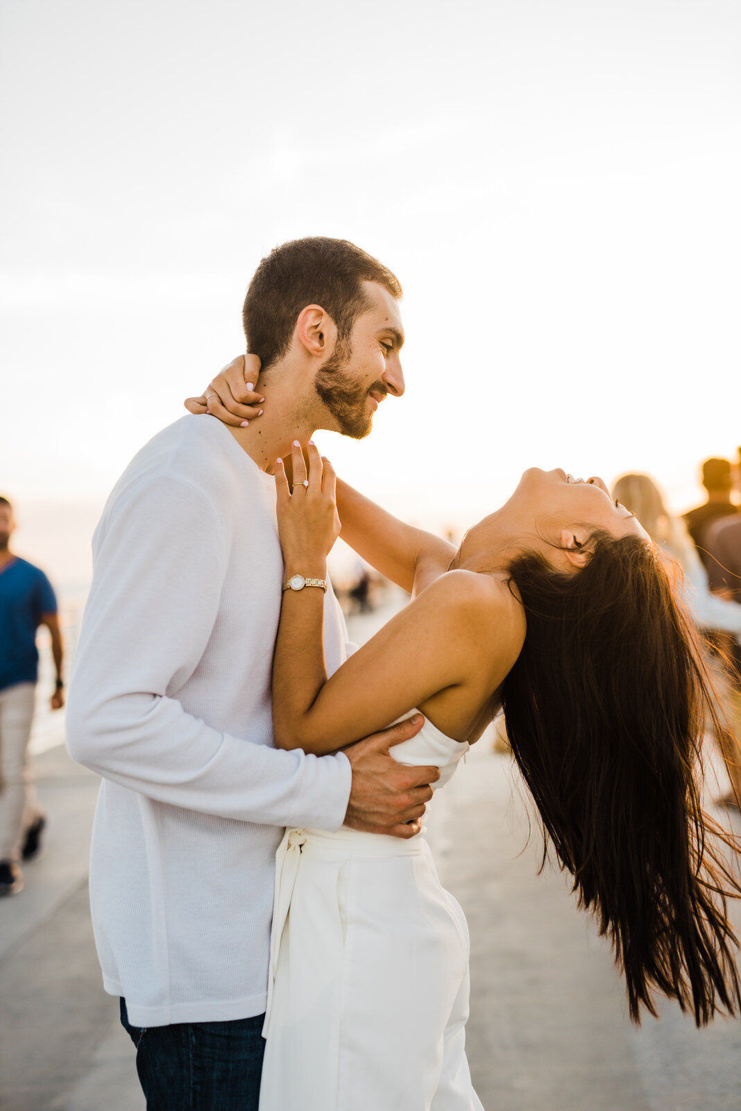 Playful, fun, energetic engagement photos at Hermosa Beach 