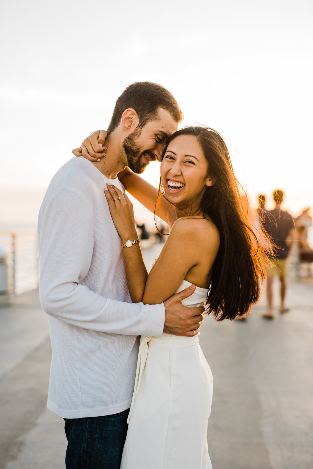 fun, exciting engagement photos at Hermosa Beach Pier