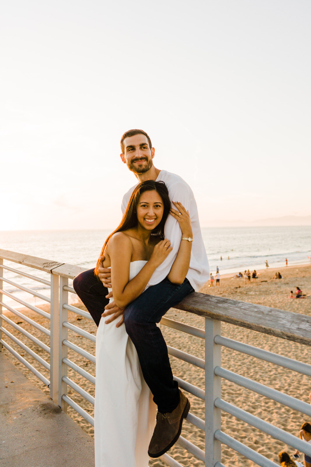 sweet and loving engagement photos at Hermosa Beach pier