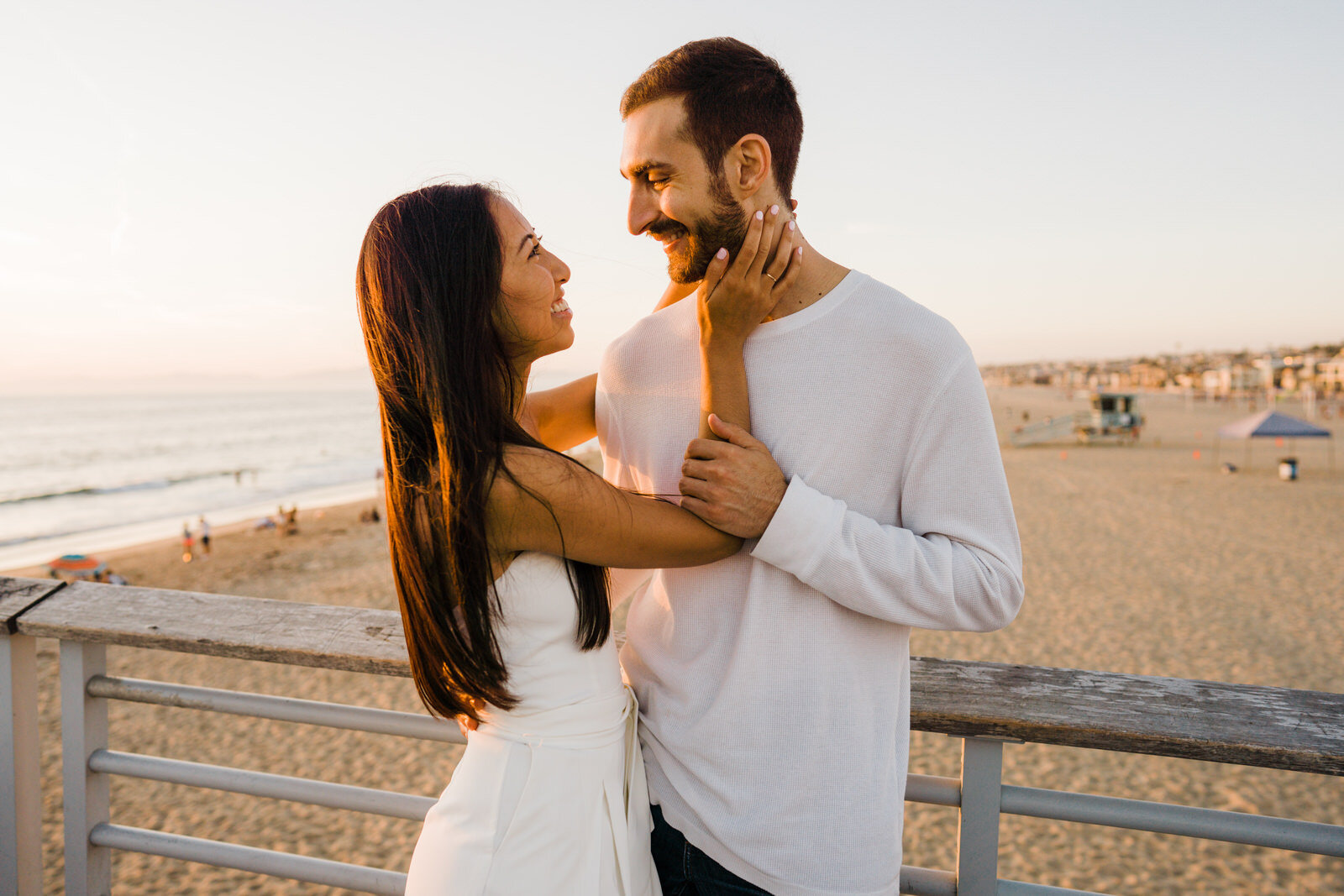 romantic engagement photos at hermosa beach pier 