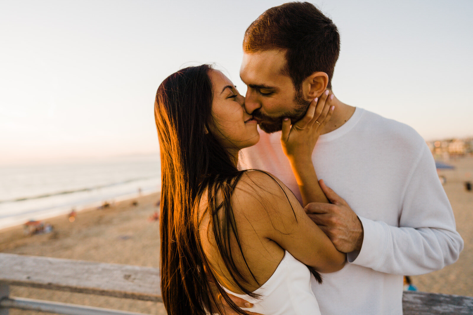 close-up photo of romantic couple engagement photos at Hermosa Beach Pier