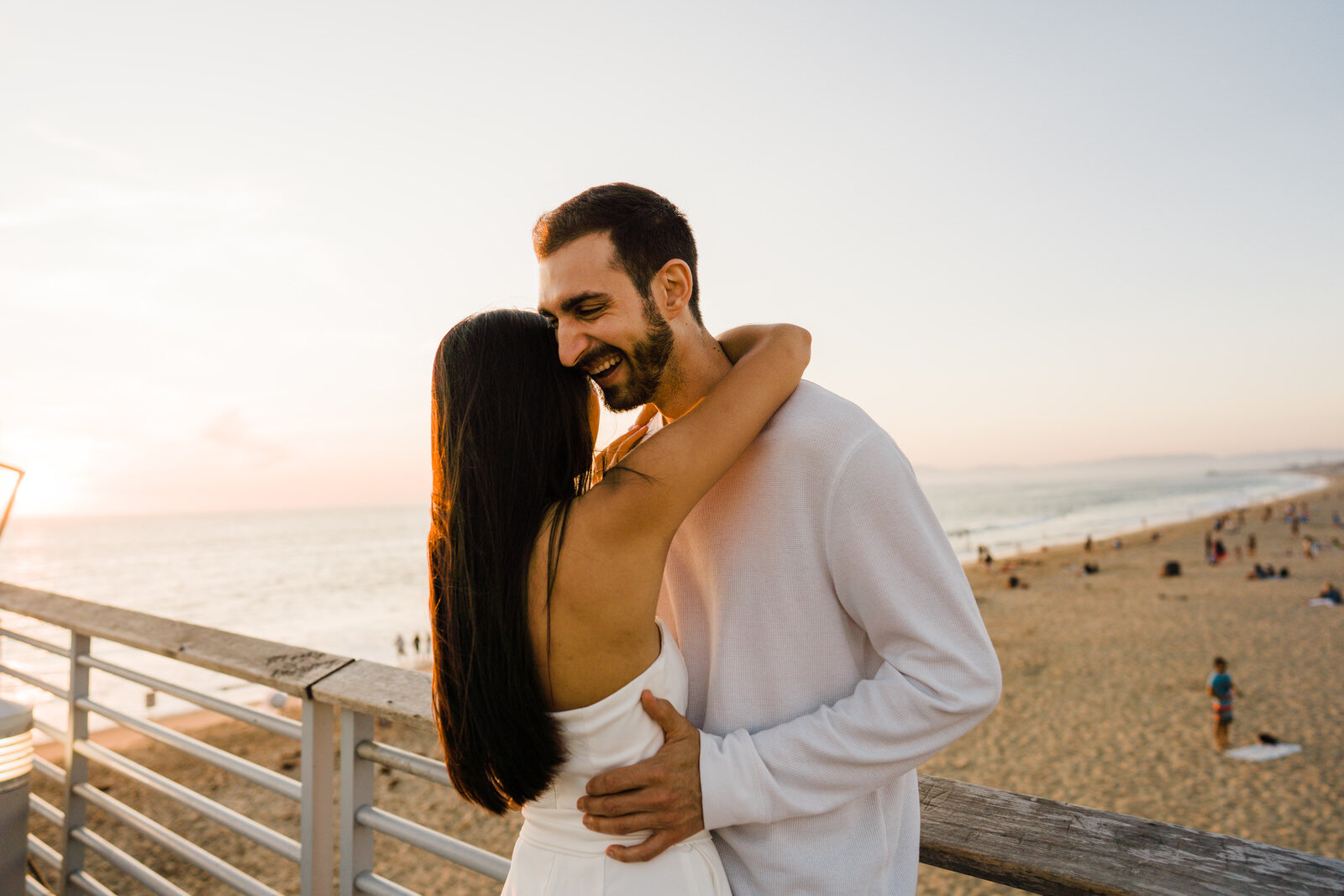 Intimate fun engagement photos at Hermosa Beach Pier