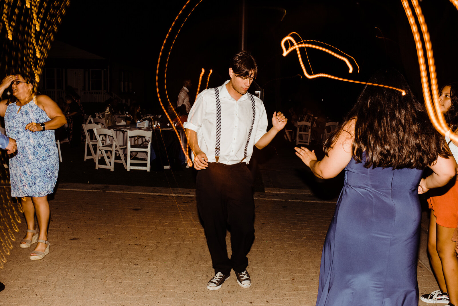 Man in suspenders dancing at Heritage Park wedding