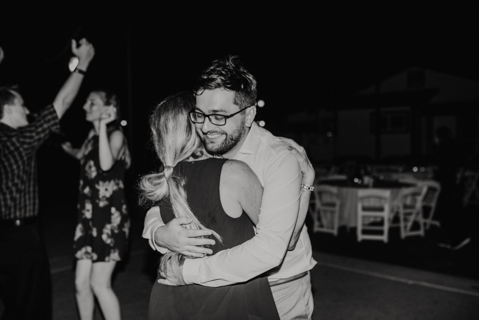 Groom and mother hug at Heritage Park wedding reception