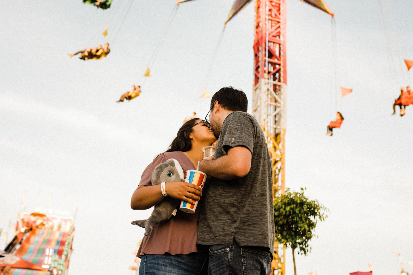 Fun engagement photos with carnival swings at the Orange County Fair