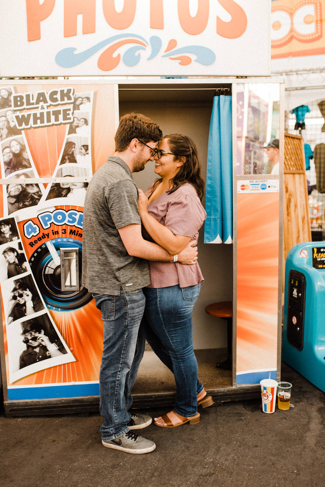 Cute, colorful, fun engagement photos at carnival photobooth at OC Fair in Costa Mesa