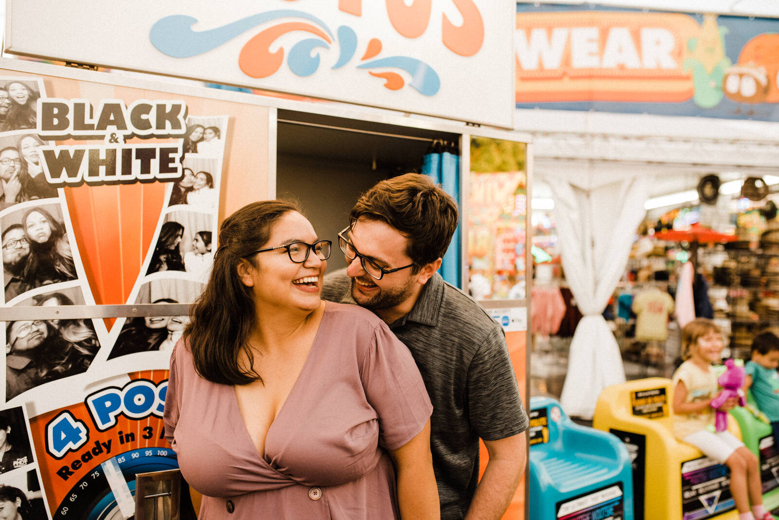 Fun romantic engagement photos at Orange County Fair in Costa Mesa Ca
