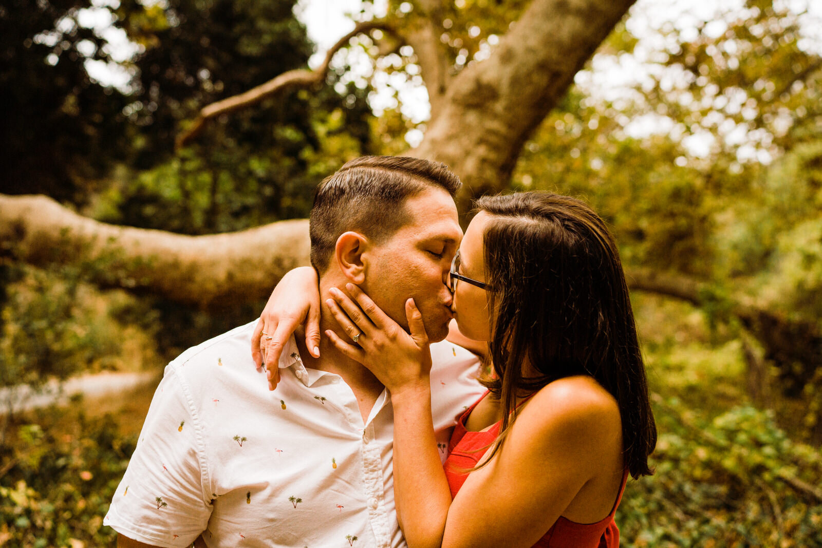 Engaged couple kiss in the woods at Franklin Canyon Park
